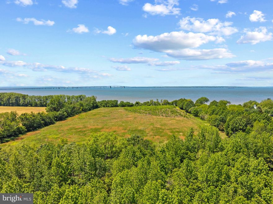 A Rare 14± Acre Waterfront Offering on Maryland’s Eastern Shore

Take in sweeping western views of the Bay Bridge and unforgettable sunsets from this private, perc-approved parcel featuring 545 feet of shoreline and a natural sandy beach. With space for horses and opportunities to hunt and fish, this property offers a serene and spacious escape—just minutes from the Bridge and convenient to Annapolis, D.C., and Baltimore. House plans and landscape renderings convey, creating a rare opportunity to craft your dream retreat on the Chesapeake.