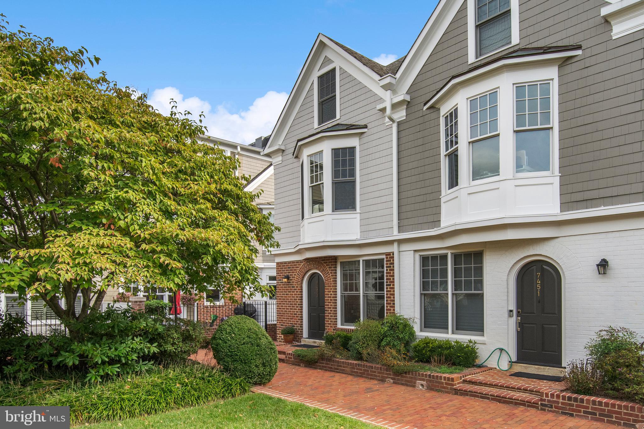Discover the best of Downtown Bethesda living with this impeccably renovated end-unit garage townhome in the coveted Villages of Bethesda community. Peacefully nestled alongside a beautifully landscaped courtyard, this sun-drenched residence is just steps from all of the shops and restaurants of vibrant Bethesda Row.
The main floor has been masterfully reimagined, creating an open-concept layout that seamlessly integrates a new chef’s kitchen with a generous dining area and a welcoming family room with gas fireplace and floor to ceiling windows opening up to a private back patio. The kitchen features a spacious island with counter seating and quartz countertops, top-of-the-line appliances, sleek cabinetry, and designer light fixtures.
Additional recent updates include: all new windows, pristinely refinished white oak hardwood flooring across all three levels, a fresh interior paint palette, new modern baseboards on all levels, new solid wood interior doors & hardware, and a custom closet system in the primary suite.
Just up the stairs, the primary suite boasts two spacious walk-in closets and a spa inspired bath, complete with a walk-in shower, soaking tub, and dual vanity. Adjacent to the primary retreat is a gracious upstairs living room with a gas fireplace and built-in cabinetry. The third floor hosts two spacious bedrooms, each with en-suite baths, and ample closet space. A dedicated laundry room with built-in shelving completes this third level.
Leave your car behind, and never search for parking in Downtown Bethesda again, as this residence features an oversized private garage with plentiful storage space. As an added bonus, just outside your private garage door, is secure community guest parking.
Seize this rare opportunity to own a slice of luxury in the heart of Downtown Bethesda. Schedule a showing today and experience the exceptional blend of style, comfort, and convenience this beautiful home has to offer.
**This unit is located in the interior courtyard of the Villages of Bethesda community located at the corner of Arlington Rd and Edgemoor Lane. Just across Arlington Rd from the Connie Morella Bethesda Public Library, there is a staircase with gated (not locked) access at the top leading to the interior courtyard. While secure guest parking is available in the common area of the garage, for showing purposes, public metered parking is available just across the street at the library.**