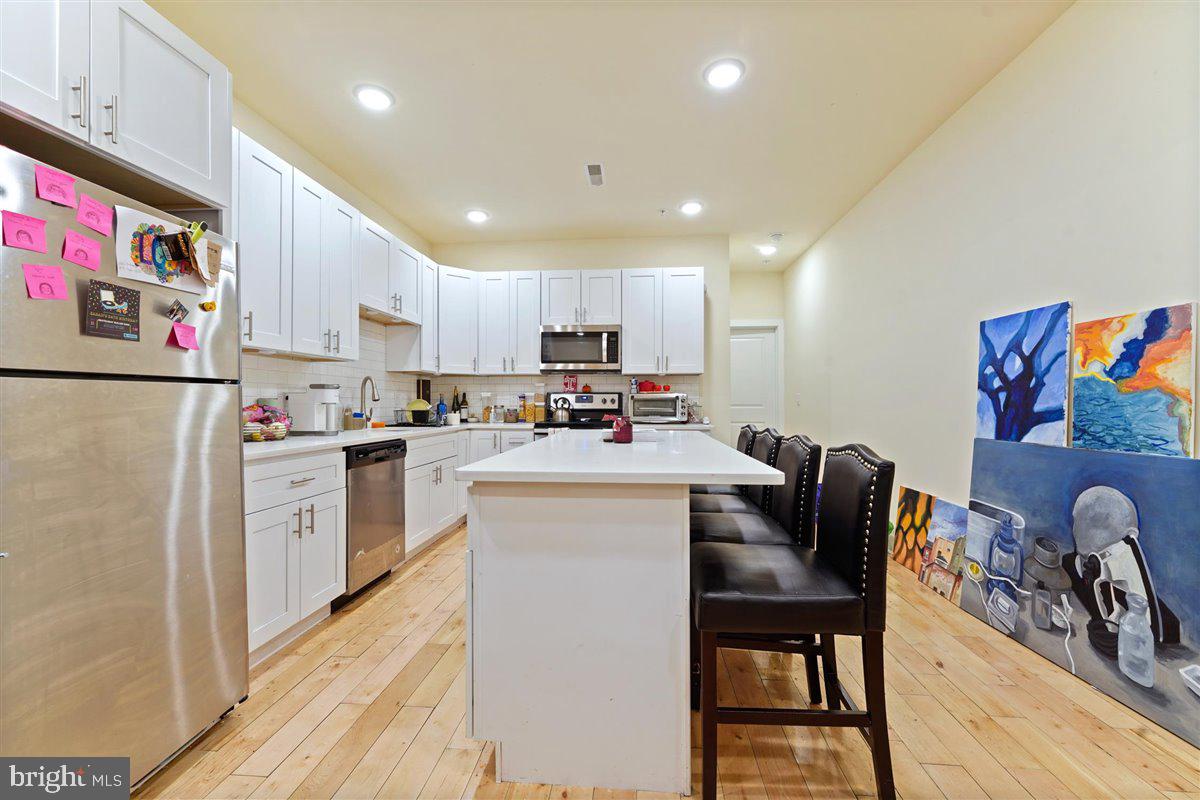 Now leasing for an August 1, 2025 move-in. This beautiful 5 bedroom 3 bathroom apartment features a bi-level layout with spacious rooms and hardwood flooring. The modern kitchen features an island, stainless steel appliances, and quartz countertops. Great location steps to Temple University campus. The landlord will allow one cat or a small dog under 25 pounds with a $25 monthly pet rent.