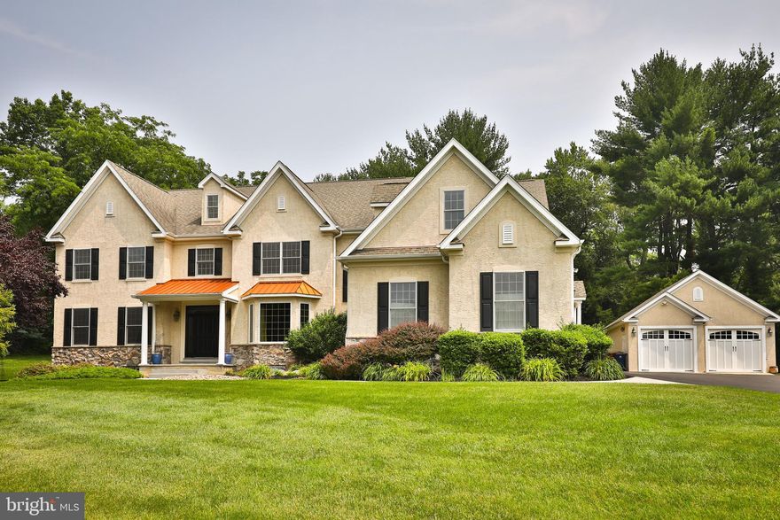 Presenting this beautiful and versatile home in the Upper Dublin SD is exciting because one discerning and fortunate Buyer is going to be beyond thrilled very soon! Set on a quiet cul-de-sac in a beautifully landscaped setting this 21 years young home is impeccably designed, with special details throughout. With an abundance of living space including a finished 3rd floor and finished lower level, there is room for everyone to have their own space and comfortably congregate together too. Rich site-finished hardwood floors, dramatic arched doorways, 9-foot ceilings, multiple (4) HVAC zones, two fireplaces and 4 garage bays are some of the features accenting this 6 bedroom 5 full and 2 half bathroom home. The large entry leads to a handsome parlor style living room with a gas fireplace, full wall of custom-built ins and metal ceiling tiles.  The stunning dining room to the right is accented with a tray ceiling and bow window.  A hallway leads to a privately located office, walk in guest closet, staircase to upper and lower levels, one of two powder rooms and a lovely view to the back of the property.  Beyond the dining room to the right, you’ll enter the fabulous cooks kitchen, with its expansive center island, abundance of solid wood cabinetry, stainless steel appliances and double desk area.  It opens to a large glass surrounding breakfast room as well as to the oversized family room with full length stone enhanced gas fireplace.  It is also open to the hallway that leads to the back entrance, full mudroom with storage, built-in garage and second powder room.  Halfway up the turned staircase is a lovely window seat, and display alcoves at the top landing accent the entrance wall to the Owner’s suite.  This extensive suite includes a large sitting room, vanity area, walk in closets and beautifully updated full bathroom with open walk in shower. Down the corridor are four generously sized bedrooms, a hall bathroom as well as a Jack and Jill bathroom.  One of two laundry rooms is located around the corner with a bonus craft/hobby or additional office room.
The third floor offers a 6th bedroom, full bathroom, plus two rooms to use as office space, game room or even a movie room. The finished lower level includes recreation and TV areas, a full gym, full bathroom and two storage rooms.  Surround sound, security system, irrigation system and additional detached two car garage are among the many extras found in this special home. The versatile floorplan easily allows for a bedroom suite on the main level if desired.
Upper Dublin is home to a blue-ribbon school system.  Excellent private schools, fabulous restaurants, shopping, country and golf clubs are all in close proximity.  This is an incredibly special home, perfect for any sized family and gatherings is offered at a perfect price point.  Call today to set up an appointment.  You’ll be glad you did!