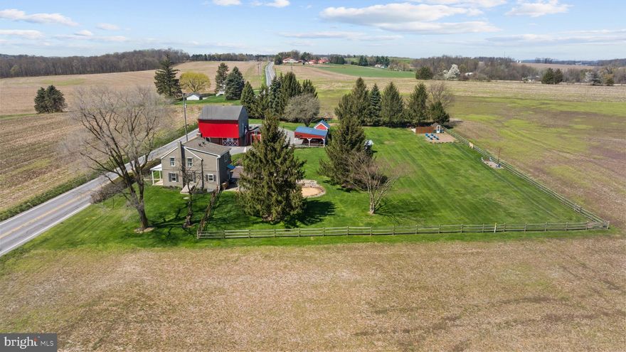 Nestled on 1.48 gently landscaped acres, this lovingly reimagined 1840 brick homestead marries timeless character with thoughtful modern upgrades. Warm wide‑plank solid pine floors, classic moldings and a welcoming layout set the tone for everyday comfort and gracious entertaining. The main kitchen is beautifully appointed with polished granite counters, stainless appliances, a farmhouse sink overlooking the country meadows, a generous pantry and a practical "friends & family" entrance with room for coats and boots. The living room centers on a handsome brick fireplace and mantle, and a convenient first‑floor powder room completes the main level. The dining room just makes you want to stay long after dinner talking and planning. 

Upstairs are two spacious bedrooms—one with a built‑in Murphy bed—and a truly magnificent family bath. The soaking tub is perfectly positioned for pastoral views, the fully tiled shower sits to the side, and a private porch off the bath invites fresh‑air relaxation. A well‑placed laundry center connects the bath to the primary suite for ease and flow.

Rebuilt from the inside out in 2017, the home features durable double‑brick exterior walls finished with refined synthetic stucco parge, metal‑stud interior framing, and high‑performance foam insulation for year‑round comfort. Major systems were replaced top‑to‑bottom: a new Takagi boiler supplies two‑zone radiant heat, all‑new PEX plumbing, upgraded 200‑amp electrical service, new windows and exterior doors, a new roof, and a four‑stage mini‑split system for precise climate control—modern reliability without sacrificing historic soul.

Outside is an entertainer’s paradise: meandering brick pathways, mature plantings, a covered patio and gazebo create intimate spaces for gathering. An adjoining outdoor kitchen with a built‑in gas grill makes al fresco cooking effortless, and the former pool pad has been prepped with electrical and conduit for easy future re‑installation. A powered "she‑shed" offers flexible space for studio, office, or hobby use.

The big red barn is a property highlight: an insulated, finished upper‑level recreation room (heated and cooled) plus an adjacent workshop with a built‑in workbench, heavy‑duty circuits, a flue for a wood stove and abundant storage. Additional third‑floor and lower‑level storage, multiple outbuildings, a greenhouse, fully fenced backyard, raised garden beds and a new well expand the homestead’s usability. Two 250‑gallon rainwater cisterns are installed, and one is plumbed underground to supply the raised beds and greenhouse.

For someone who values permanence and peace of mind, this home delivers—careful craftsmanship and thoughtful upgrades let you enjoy history without compromise. Quiet country living, generous entertaining spaces and practical, sustainable systems come together in a rare, lovingly cared‑for homestead ready for its next chapter. Contact me to schedule a private showing and fall in love with this special property. 





OpenAI GPT-5 Mini