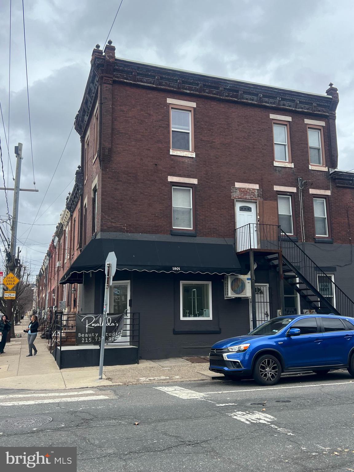 Incredible opportunity to own a mixed-use, multi-unit property where Northern Liberties meets Fishtown. Zoned for both commercial and residential use, this corner property features three street-level suites: one leased to a barbershop at $950/month, one vacant, and one currently used as a salon—owner is willing to leave all equipment for a turnkey setup.
The second floor is a 2-bedroom, 1-bath apartment currently rented for $1,040/month. The third floor is also a 2-bedroom, 1-bath unit rented for $1,200/month. Located just steps from public transportation, major highways, restaurants, bars, cafes, and breweries. Ideal for a business owner or investor seeking multiple income streams in a prime location.