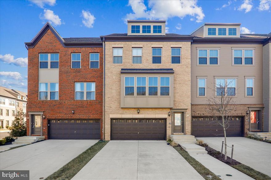 AVAILABLE NOW! This interior unit town-home has a brick foundation, designer finishings, and will reflect the personality and taste of those accustomed to the best in quality design, finishes and lifestyle. The ground floor incorporates a generously proportioned recreation room that could also be used as a bedroom that comes complete with a full bath and walk-out to your backyard with privacy fencing on each side. The main level has an amazing open floor plan that includes a powder room, luxury vinyl floors, a spacious center island that seats four, stainless steel appliances, and easy access to the large deck. Upstairs, you will find three bedrooms, a family-sized bathroom and washer and dryer. The primary bedroom comes with a walk-in closet, ensuite bathroom with double sinks and luxury stand up shower with seating. Other highlights of the property include a 2-car garage, upgraded fittings & fixtures and plentiful storage. With transport, schools, Ritchie Station Market Place, and MGM National Harbor just minutes away; dining & leisure facilities anxiously await! This is an ideal place to call home!