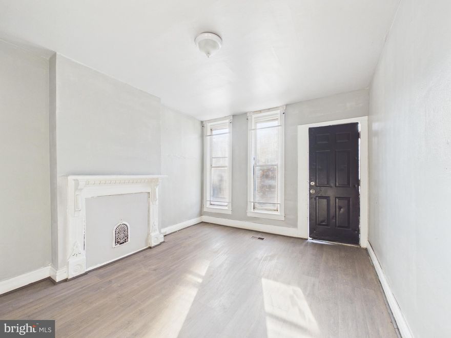 Great portfolio add or value-play in West/Southwest Baltimore! 2BR brick rowhome with luxury vinyl plank flooring, separate living room + dining area, and solid layout for a rental hold or renovate-to-resale strategy. Surrounding blocks show continued reinvestment and redevelopment momentum—Hollins Market’s revitalization, the growing UM BioPark / 4MLK life-science hub, and broader city/state-supported neighborhood initiatives add to the long-term upside. Convenient access to Downtown, UMB area, major commuter routes and transit. Buy, stabilize, and let the area grow around you. Sold strictly as-is—schedule your showing today.