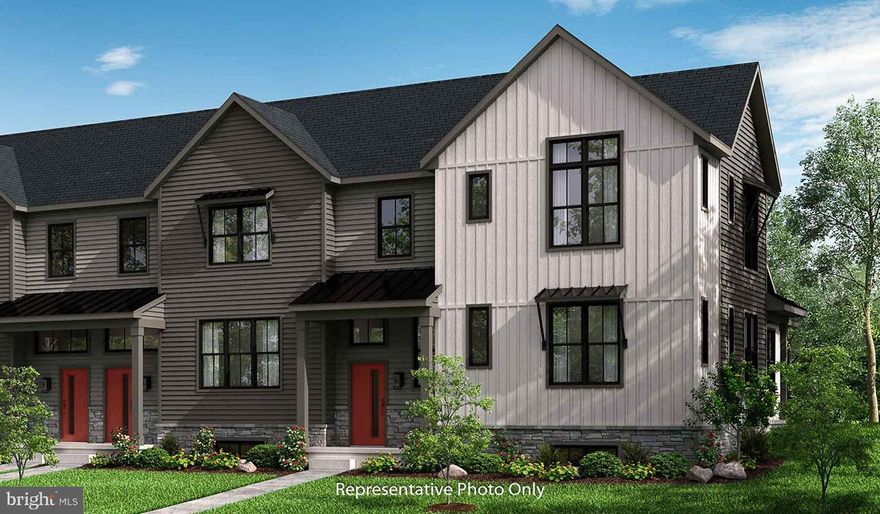 This 2-story, end-of-row townhome includes a first-floor owner’s suite and a cathedral ceiling in the living and dining rooms. A 2-car, rear load garage opens into a mudroom with built-in lockers and laundry room access. Beautiful vinyl plank flooring adorns the main living areas on the first floor. The living room, accented by a fireplace, opens to the well-appointed kitchen with stainless steel appliances and quartz countertops with a tile backsplash. Sliding glass doors in the dining area provide access to the rear patio. The owner’s suite features an expansive closet, and a private bathroom with a tile shower and double bowl vanity. On the 2nd floor is a loft space, two additional bedrooms, and a full bathroom.