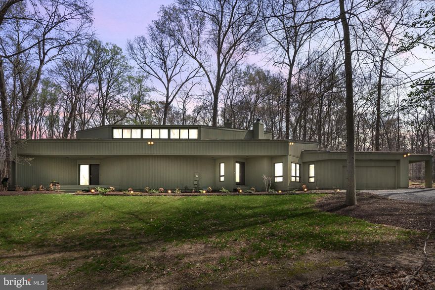 Spectacular updated contemporary sited on nearly two serene private acres at the end of a cul-de-sac. This wonderful residence is bathed in light via the multiple windows and numerous glass doors which overlook the gorgeous yard. This house has everything you want on the more than 5000 finished square feet. The open floor plan flow allows for entertaining on a grand scale, inside and outside, or just for a cozy family evening in front of the fire. 

The spectacular Family Room has a dramatic soaring ceiling and huge windows. The kitchen, not only has a Breakfast Bar, but also offers a separate Breakfast Room with fireplace.. There is also a formal Dining Room. The large main level laundry room has been completely fitted out.  OPEN SATURDAY & SUNDAY, APRIL 5 & 6 from 1pm - 3 pm.



The house offers multiple balconies and stunning dramatic angles. There is a Sonas sound system/speakers that are available inside and outside. Outside there is a huge patio over-looking the open space but is surrounded by trees which provides ample privacy and the perfect haven. The capacious attached 2 car garage offer additional (separate) storage. There is also a car-port.

It is perfectly located so close to River Bend Golf and County Club with a multitude of activities (membership required). The house is also only minutes away from the Village of Great Falls where there is a selection of restaurants, shopping and services. Both Great Falls Park and Riverbend Park are very close-by.