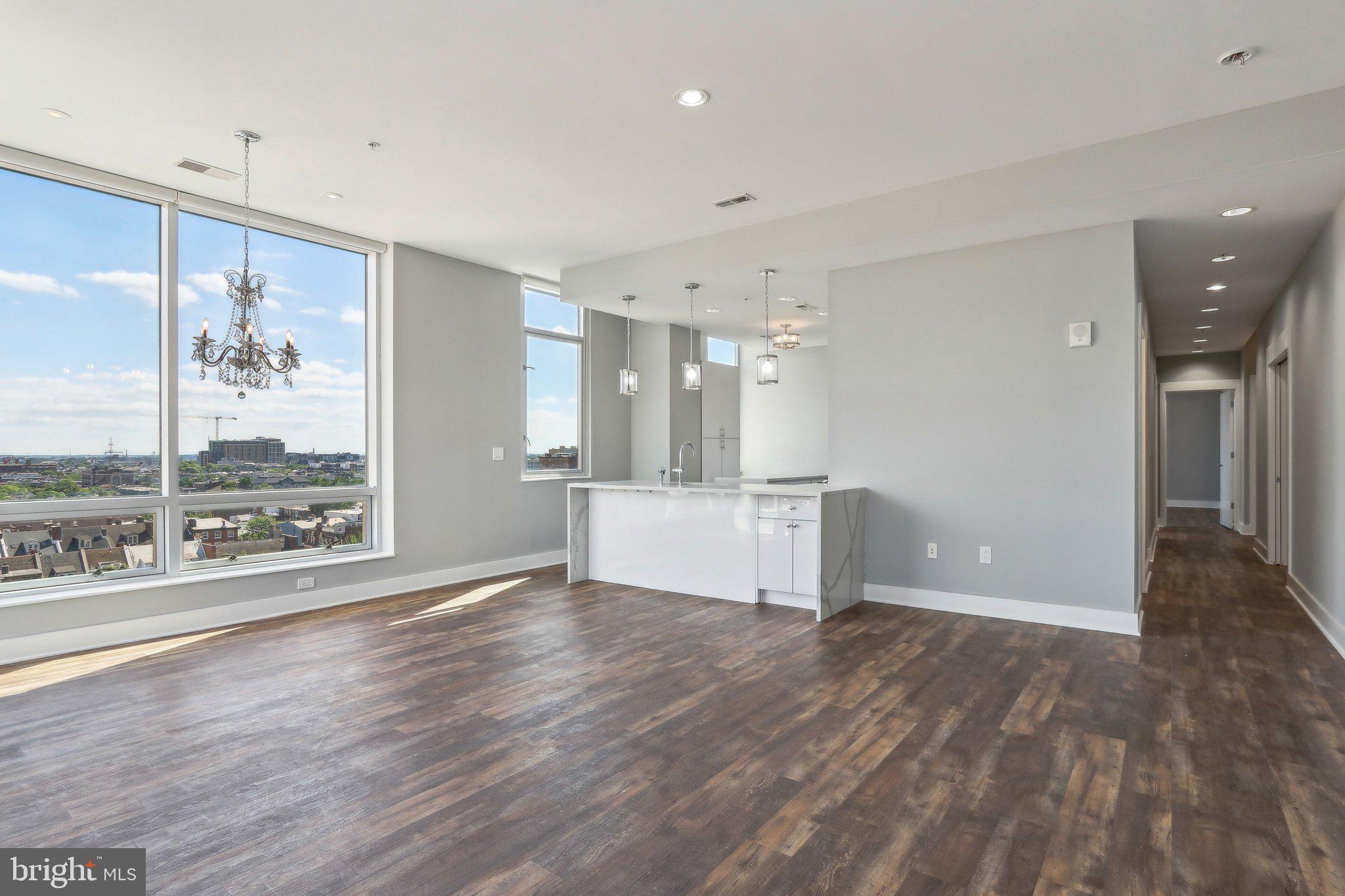 Philly meets Soho in this exceptional corner condo with sweeping views, luxury finishes, high ceilings, 24-hr concierge, and garage parking in Washington Square West.
Never have 3 bedrooms and 3.5 bathrooms been this affordable in a luxury setting. The massive main living/dining area is sun-drenched open space, with 10-ft ceilings, huge windows, and long-range southern and eastern views. A large bonus room has endless possibilities: a den, dining room, office, gym…totally flexible space to suit your custom needs. The contemporary kitchen dazzles with copious white lacquer cabinetry, stainless appliances, waterfall quartz countertops, island, and bar stool seating. A powder room and laundry room abut the kitchen on either side.
The Primary suite and Junior suite include dreamy walk-in closets, huge windows, extra-large bathrooms with dual vanities, soaking tubs, and glass-framed showers. They are at opposite ends of the unit, providing the utmost in privacy for each space. The third bedroom also includes an en suite bath and ample closet space. Building has extra storage on the 3rd floor and a dog run.
Easy walk to fitness, coffee, grocery, shopping, parks, pickleball, PATCO, Antique Row, the Forrest & Walnut Theaters, the Convention Center, Reading Terminal, the Academy of Music, and the Kimmel Center, not to mention some of the hottest restaurants and night spots in the City. The city’s finest dining, arts, and culture are at your doorstep, along with Jefferson and Pennsylvania Hospitals.
Designed by award-winning architect Cecil Baker, the historic Western Union Building exudes contemporary, sophisticated style. This rarely lived-in unit feels brand new and will not disappoint.