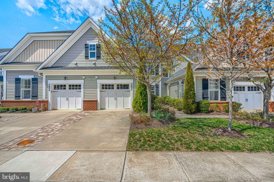 Active Adult Community for 55+  This gently occupied home was built in 2016.   All freshend up giving  a pleasant tour.   You will see that the current owner has made a welcoming home where everything can be done on the first floor, including getting out of your car and walking into your home, avoiding the cold or the rain.  2nd floor offers a bonus of privacy for your visitors.   Long views right from your 1st floor indoor space by the gas log fireplace or from your outdoor patio space, enjoyable through the Spring, Summer and Fall seasons.  Lots of "green space" for your pleasure, maintained by the HOA.  Electric awnings create a shady lounge when needed too, right on your patio, outside your kitchen.  Area streets are designed for slower driving and quieter walks or rides through the neighborhood.  There is even additional parking spaces set for visitors to your block.  Come for a tour, not only of your next home, but your next neighborhood.   Both are impressive.