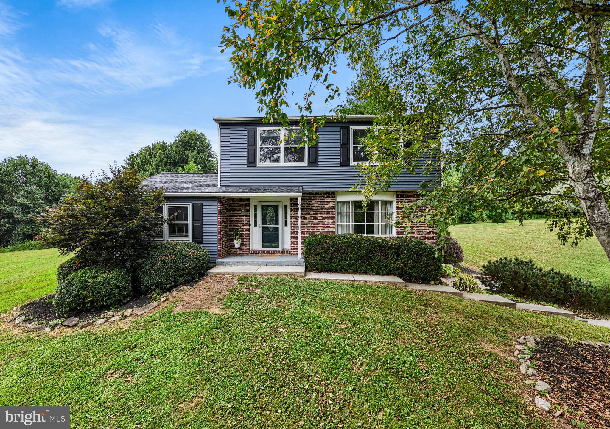 Nestled in the prestigious neighborhood of Landmark Farms, this charming Colonial-style residence is a true private sanctuary that beckons you to experience a lifestyle of tranquility. The current owner has surrounded the property with a variety of plantings including a majestic Weeping Willow, Apple Trees, Birch, Trees, White Pine Trees, and numerous flowering bushes. The heart of the home features a newly remodeled well-appointed kitchen, ready for your culinary adventures. The second floor hosts a laundry area, three ample sized bedrooms, hall bath and additional sink in the primary bedroom dressing area. The thoughtful design ensures seamless flow between rooms, making it ideal for both intimate gatherings and larger celebrations. New detached garage and New shed offer plenty of storage while the driveway provides ample parking for guests. Picture yourself sipping morning coffee on the deck or enjoying a quiet evening under the stars enjoying the New hot tub or sitting around the fire pit roasting marshmallows. The fully finished walkout basement with New full bath and extra room can easily be transformed into an in-law suite with ground level private access. With nearby amenities you'll find everything you need just moments away. Whether you're exploring local parks or indulging in nearby dining options, this location offers the perfect balance of convenience and serenity. Don't miss the opportunity to make this exquisite residence your own. This home has New HVAC condenser unit, New well pump and lines, New roof, and New siding. See upgrade sheet for all recent home improvements.