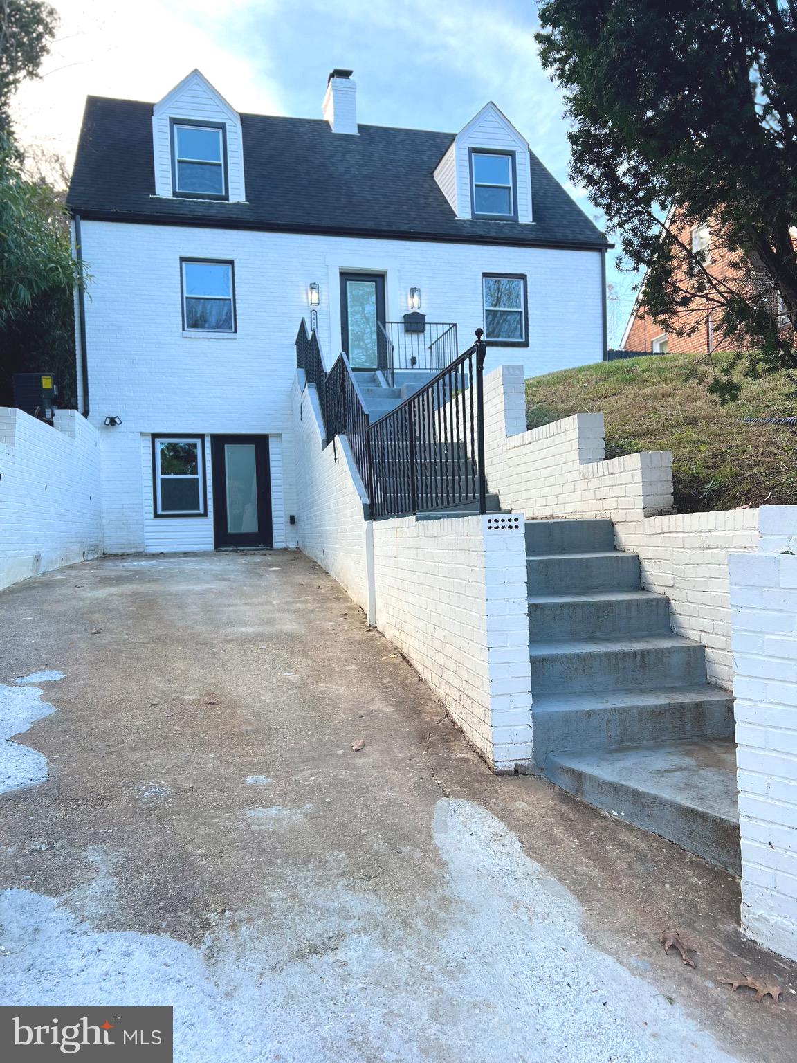 Beautiful home in sought after Cheverly. freshly painted, wet bar in the lower level, Close to Cheverly Swim & Racquet Club, Cheverly Metro and Farmers Market. Easy access to downtown DC, Capitol Hill, Hyattsville Art District, UMD as well as the retail of Dakota Crossing (Lowes, Costco, Starbucks), Woodmore Town Center (Wegmans and more) and Landover Road (Aldi, Walgreens)Enter this lovely home that sits on a hill, rendering great views from every room , privacy, and tons of natural light throughout. This (3) bedroom (4) bathroom home has tons of charachter and a very nice layout. Enter thru the glass doors onto the main or lower level of the home as both levels have thier own entries from the front of the home. ***Hardwood floors throughout the main and upper levels *** living room on the main level has ceiling fans, wood burning fireplace, custom shelving and recessed lighting **half bath on the main level** Kitchen/ Dining Room w/ recessed lighting as well as modern hanging lights, over large island, Stainless steel appliances, quartz counter top*** off of the kitchen there is a lovely glass door leading to the deck & backyard *** Upper Level has Primary Bedroom w/bathroom w/ modern barn door entry & hardwood floors*** **soaking tub and custom tile on floors and walls*** second bedroom on the upper level has hardwood flooring, ceiling fan ,recessed lighting, 2nd bathroom on upper level has tub/shower combo & custom tile***Lower Level w/ livingroom , 2nd fireplace , Washer/ Dryer , Wet Bar area w/ SS microwave , wine refrigerator , custom tile floors throughout lower level. Bathroom w/ Shower ** Lower Level Bedroom w/ ample closet space , ceiling fan and private entry thru lovely glass door leading to the front home driveway. Roof top deck and Fenced in deck & back yard area** $3000 appliance credit *** This home is a must see.