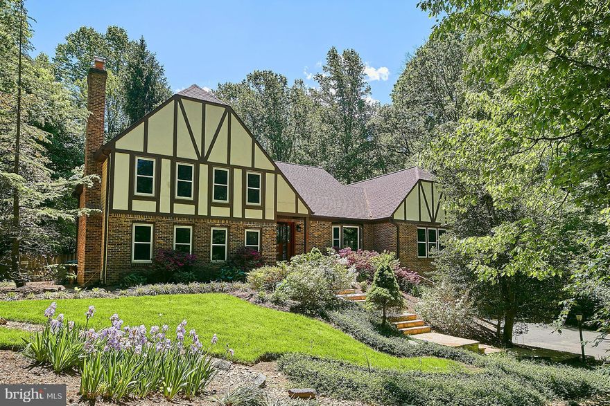 MOVE FAST!  HUGE PRICE DROP!  Entertain in style! Spectacular SF w/ 4 fully fin lvls, premium priv 2-ac lot WITH POOL! 4 BR, 5 BAs, 2 car gar, 3 FPs & hardwood flooring. Main lvl features kit w/ ss app & granite, grand dining & liv rooms w/attached sun room overlooking deck, pool & hot tub!  Master Ste w/ his & her full baths, sittng rm, more! EXTRAORDINARY updates & custom features thruout!!!