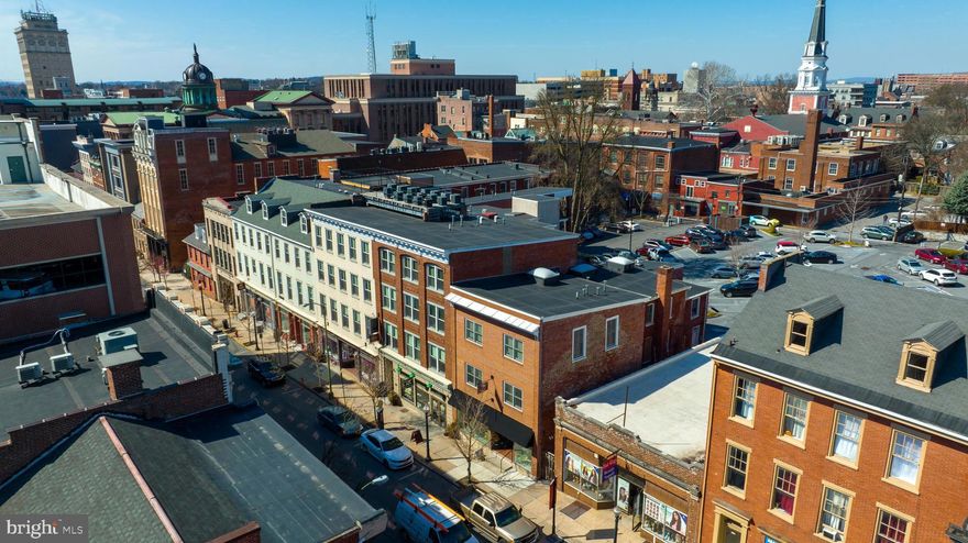 Unit 411 is on the top floor at Historic East Side Condominiums offers quiet living with a peaceful view over Grant Street.  The layout includes open living space feels spacious because of the design and natural light.  Historic East Side was a complete rebuild of the historic buildings meaning that the structure itself is solid limiting sound transfer from other units.  The roof deck looks over Grant Street and you can enjoy the view and hear the birds sing .
This is an outstanding unit with a dedicated parking space and an exclusive garage close to Grant Street entrance. All appliances are staying and the floors,  kitchen and bashes all look like new.