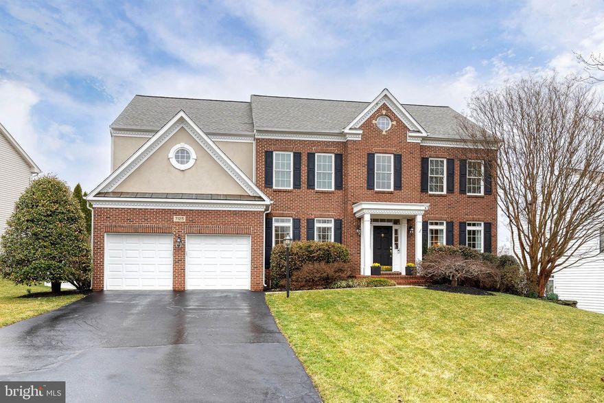 Welcome to this beautifully maintained 4-bedroom, 4.5-bath home in the highly desirable Grovemont community, offering 4,734 square feet (including the finished basement) of thoughtfully designed living space and proudly owned by its original owners.

Step inside to a welcoming entry with maple flooring and a dramatic two-story foyer that opens to a spacious family room featuring a gas fireplace and stunning floor-to-ceiling windows that fill the home with natural light.

The updated kitchen is ideal for both everyday living and entertaining, showcasing new quartz countertops, a large center island, maple cabinetry, a walk-in pantry, and a gas cooktop. A stylish wine bar w/ quartz countertop, wine refrigerator, and floating shelves adds a perfect entertaining touch. The bright breakfast area opens to a large deck overlooking the backyard—perfect for outdoor dining and relaxing.
The main level also includes a private office with French doors, a formal dining room, a living room with custom built-in bookshelves, and a convenient powder room.

Upstairs, dual staircases lead to four bedrooms and three full baths. The spacious primary suite features a double-door entry, vaulted ceiling, two walk-in closets, and a versatile sitting room—ideal for a reading nook, fitness space, or private retreat. The ensuite bath includes a soaking tub, walk-in shower, and dual vanities. One secondary bedroom offers a private ensuite bath, while the remaining two share a Jack-and-Jill bath. The laundry room is conveniently located on the upper level.

The finished walk-out basement is an entertainer’s dream with a kitchen and bar featuring maple cabinets, granite countertops, refrigerator, and dishwasher. Additional highlights include a wine cellar, a gas fireplace, a bonus room currently used as a bedroom, and a full bath w/ walk-in shower—perfect for guests or extended living. A large storage area and workshop add excellent functionality. Step outside to a patio overlooking the beautifully maintained landscape.

Recent updates include new carpet with upgraded padding (2024), dual-zone HVAC systems and a 75-gallon gas water heater (2019), a 5-burner gas cooktop (2019), and a new roof (2017).

Enjoy direct access to nearby trails leading to Rockburn Park and Patapsco State Park, offering miles of outdoor recreation. Conveniently located near I-95, Route 100, Route 29, and BWI Airport, this home combines peaceful neighborhood living with exceptional commuter access.