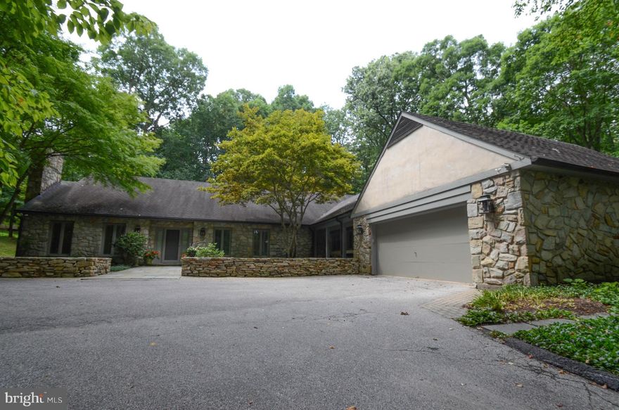 One-of-a-kind single family, detached, stone & stucco corner home on one floor with over 4,600 sq.ft. of exceptional flow.  Huge open kitchen- family room, gracious dining room, screened-in porch with fiberglass panels for winter and loads of windows.  Could be three or four bedrooms.  Dazzling floorplan!  Special assessment of $270/mo thru 6/30/17.