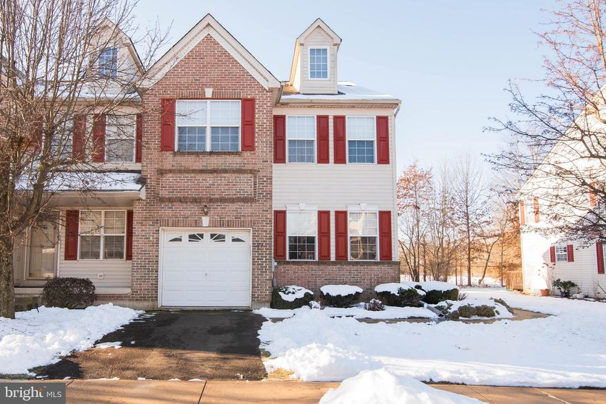 Located in Hatfield Borough in North Penn School District, this large 4-bedroom End Unit, 2.5-bath townhouse offers comfort and functionality in a lovely neighborhood setting.  Home features a finished basement, 1 car garage, and a loft/4th bedroom space in the desired Heather Meadows Community. As you enter, you're welcomed by an open formal living and dining room combination, ideal for both everyday living and special gatherings. Beautiful hardwood floors lead you into the bright and open family room and kitchen area. The spacious kitchen offers ample cabinetry and counter space, with a layout that keeps it connected yet distinct from the main living areas. Step outside to a private deck backing up to mature trees—a perfect spot to relax or entertain in peaceful surroundings. Upstairs, you'll find the spacious primary suite which features a private en suite bathroom complete with a soaking tub, while the convenience of second-floor laundry adds to the home's thoughtful layout. Two additional bedrooms and a full hall bathroom compliment this floor. Head up the stairs to another level where you will find a large loft which could be used as a 4th bedroom or office/playroom. The basement is finished with modern LVP floors and contains an unfinished area for storage. The finished basement is a true bonus.  Home also has a recently installed new roof and heating/cooling system. With an attached garage, plenty of storage, and easy access to major routes, Heritage Park walking path, pond, and playground within walking distance, shopping, and dining, 369 Wheatfield is waiting for you. Convenient to major employers like Merck. HOA handles lawn, snow and trash. Schedule your private tour today!