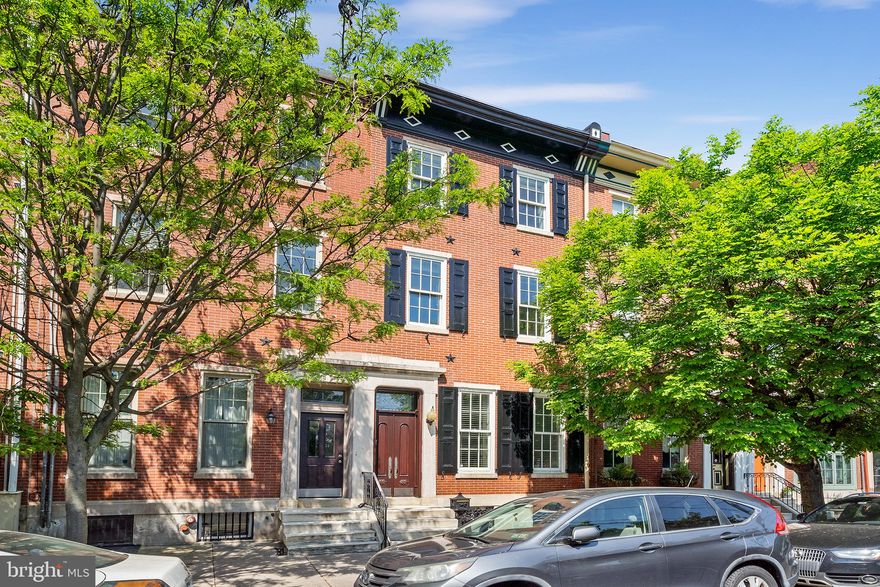 Welcome to 712 S 10th Street, a park-front home that sits on a 109 foot deep lot with PARKING in the rear that oozes character and luxury throughout. Amassing a total of almost 4,600/SF of living space, 4 Bedrooms, 3 Full Bathrooms, 2 Half Bathrooms and multiple flex spaces, this home was renovated to the highest standards and ahead of it’s time, roughly 15 years ago. Walk through to the solid wooden double doors and through the marble tiled vestibule into the hallway and find the spacious living room to you right, that overlooks the park, with an original marble fireplace mantle, wainscoting and crown moulding throughout. Situated behind the living room is a large coat/storage closet and a powder room for convenience. Solid cherry hardwood flooring is throughout the home. Step into the kitchen and onto the terrazzo floor tile and you will find a custom kitchen with solid wood cabinets, outfitted with Wolf & Sub-Zero appliances that include a cooktop, double oven/speed oven combo, single refrigerator and freezer columns, wine fridge & dishwasher. Granite countertops continue up the backsplash and are also on the extra long island and make for the custom built table in the kitchen nook. Behind the kitchen you will find extra living space, with herringbone hardwood floors and a dramatic ceiling heigh of roughly 20ft that allows tons of natural light to soak the room. Double glass doors lead outside to the rear parking space that can also moonlight as a rear yard, protected by an automatic garage door. Up the original refinished staircase you will find a custom built laundry room where you will loving doing laundry and a flex space that is open to below that can be many things (office, playroom, informal living, workout area, etc.) Take a half a step up and you will find the Primary Suite with park views on the 2nd Floor. Inside the Primary you will find 2 custom outfitted closets, a bedroom large enough to fit the bed of your choice plus other furniture, and a luxurious Carrara marble-tiled Primary Bathroom, complete with heated floors, freestanding soaking tub and a shower with body jets, wand and rain-shower head. Upstairs on the 3rd Floor you will find 3 large bedrooms each with great closet space, and extra walk-in closet and 2 modern-tiled bathrooms with Kohler fixtures. Downstairs in the fully finished basement you will find heated floors, a large living room with custom cabinetry that includes a built-in Wolf microwave, Sub-Zero refrigerator and separate Ice Machine and a dishwasher for entertaining family and guests. Downstairs is also a half bath for convenience, a well kept, neatly organized mechanical room and storage that goes on for days. This home has two Central Air Units for 2 different zones, and 2 hot water radiators for two different zones to give you the best of both worlds. Over 400AMP service coming in with 3 electrical panels, videophone, heated floors in every bathroom and underneath the basement floor for those winter months. 712 S 10th Street is the epitome of Philadelphia and located just steps from Center City and the hospitals including Jeff & Penn. With a WalkScore of 97, this beauty is situated in a Walker’s Paradise and is just steps away from Bella Vista’s best amenities, including; the 9th St Italian Market, Angelo’s Pizzeria, Saloon Restaurant, Fitzwater Cafe, Isgro Pastries, Anthony’s Coffee House, DiBruno’sand many many more.