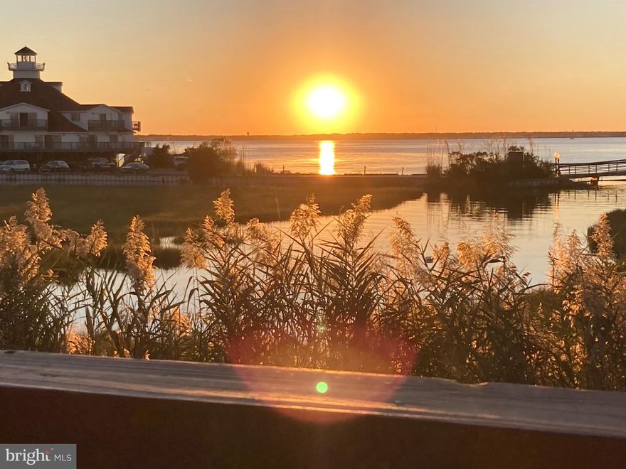 Welcome to Sunset Landing, nestled in the heart of Midtown Ocean City, this exquisite two-bedroom, two-bath condominium offers the perfect blend of coastal charm and modern convenience.  Overlooking the serene waters of the Isle of Wight Bay, this home provides stunning panoramic views of the water and picturesque sunsets and also comes fully furnished. The interior boasts a spacious living area, a fully-equipped kitchen and two well-appointed  bedrooms.  With this layout, you'll enjoy the comfort of a primary en-suite, offering the perfect blend of privacy and functionality.  Whether you are savoring your morning coffee on the private balcony or enjoying the community's outdoor pool, this condo epitomizes the coastal lifestyle, making it an ideal retreat, year-round residence or a savvy investment property.    Notable updates include the replacement of all three sliders in 2017, as well as a new HVAC and hot water heater installed in 2021.   With two parking spots, one of them covered and marked, convenience is at your doorstep.   Additionally, a private storage shed provides ample space for your kayak, bicycle, beach chairs or umbrella.  Don't let this opportunity slip away -- seize your very own piece of paradise by the beach today!