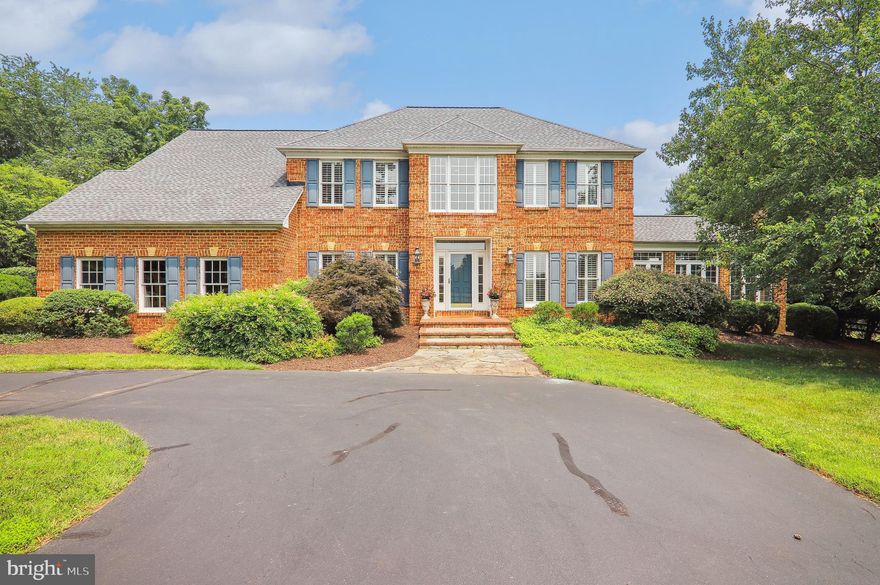 Prepare to be WOWED! This stately Colonial is set back on a 2+ acre lot on a quiet cul-de-sac street with custom landscaping as if designed for a magazine. The gardens have been thoughtfully laid out so that there is always something blooming as you relax on your private decks, enjoying a bubbling fountain while watching the sunset or swimming in your personal in-ground pool. Custom finishes throughout include plantation shutters, walls of windows, and an enviable main level Sun Room addition with a fireplace, full bath, and access to the rear yard and pool. This home also features hardwood flooring on the main level, two discreet and separate in-home offices, new wall-to-wall carpeting on the upper and lower levels, and new 75 gallon hot water heater. The sunny and fresh, open floor plan makes this the perfect home for entertaining with multiple access points to the rear decks, expansive rooms, and soaring ceilings. You’ll love the location near parks, shopping, and access to the famous Glenstone Museum. You won’t want to miss out on owning your own personal oasis. Enjoy!