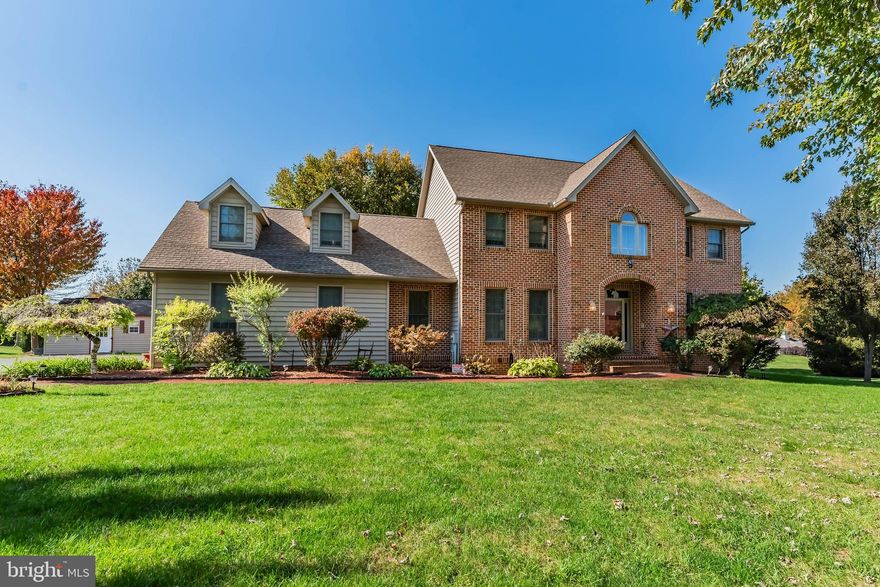 Step in to your dream home in the highly sought after "Callapatscink"  neighborhood, where quality construction meets exquisite detail with this stunning Norm Elam built 2 story. The entire interior is new as of Summer 2025. This includes CUSTOM made Amish built “soft close” kitchen cabinets, island and all vanities. The kitchen boasts granite countertops, new appliances and a generous island, that opens to the family room with gas fireplace, perfect for entertaining and relaxing. As you step into the two story foyer, you will find brand new luxury vinyl plank flooring that flows seamlessly throughout the first and second floors. Formal living room and dining rooms are adorned with elegant crown molding, setting the stage for memorable gatherings. A luxurious primary suite awaits with tray ceiling, spacious walk-in closet and a brand new walk-in tile shower. With 3 additional bedrooms and a versatile 5th bedroom/bonus room over the garage, there's ample space for family & guests. Step outside to the oversized covered deck, ideal for hosting friends or just enjoying the quiet country evenings. The basement offers plenty of storage space and has a convenient back staircase leading to the garage. Mechanicals are in great shape with a new furnace and hot water heater as well as Anderson tilt-in windows throughout. As you stroll along the brick lined sidewalks with mature trees, you will immediately feel the charm of this fantastic rural setting.  This exceptional home awaits its new owner!