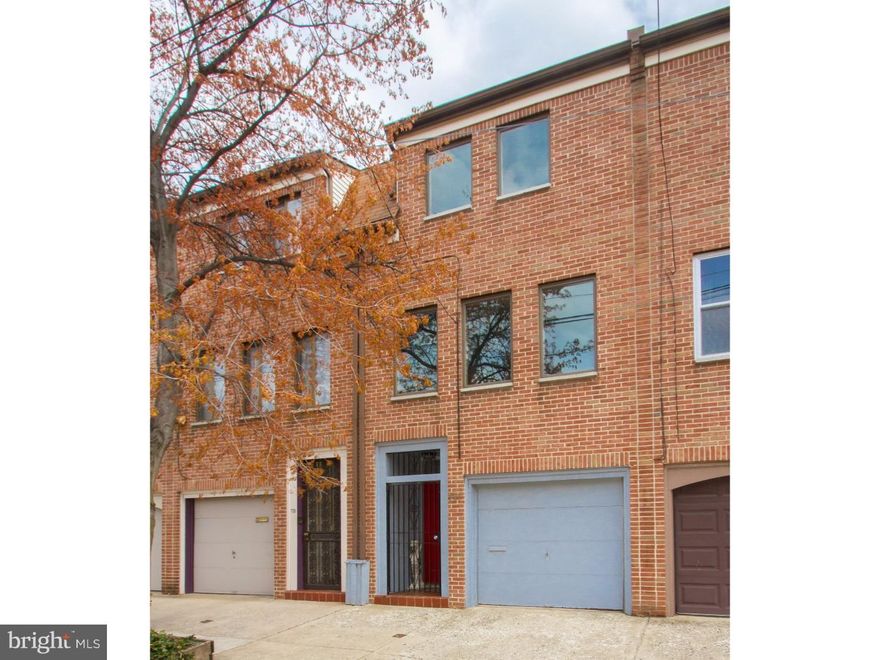 Stunning two bedroom, two bath home with roof deck and garage parking! Shows like a dream come true! Just wait until you see how this modern home has been refinished with high-end touches usually found in much more expensive homes. The interior has been recently upgraded including all new Anderson windows and maple hardwood floors throughout. The modern kitchen has been designed to maximize counter and cabinet space and includes top-of-the line appliances and attentive details: gas Wolf stove, Fisher & Paykel counter-depth refrigerator, Bosch dishwasher, granite counter tops, solid-wood cabinets, and glass-tile back splash. The kitchen provides access to a stone-paved patio, perfect for grilling and entertaining. The living room includes custom built-in shelving and a wood-burning fireplace. Bathrooms have been remodeled and include mosaic and subway tile work, along with new toilets, bathtub, glass shower stall, and fixtures. Feel comfortable all year round with a new central air and gas heating unit and new water heater. In addition, you will find plenty of storage space and a high-efficiency LG washer/dryer in the basement storage room. This home also boasts a private roof deck and an attached garage! Many neighbors here also park a 2nd car out front of their garage space and don't seem to get any parking tickets!  Clean design and thoughtful upgrades characterize the interior of this contemporary town home on a fantastic block in the city. Within steps of Wholefoods, ACME, Starbucks and a variety of bars and restaurants, this home truly stands in the ideal urban location.