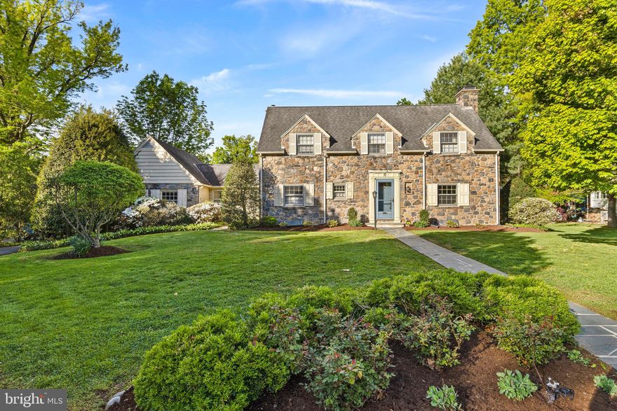 Location, Location, Location. Situated in one of Swarthmore’s most coveted neighborhoods, this wonderful 3-bedroom, 2.5-bathroom stone Colonial offers a lifestyle of unparalleled convenience. With Swarthmore-Rutledge Elementary (SRS) and the Swarthmore Swim Club just blocks away—and Henderson Field serving as your "extended" side yard—this home is perfectly positioned for active suburban living and the "walkability" feature that every Buyer is looking for!  Step inside to a lovely center hall featuring a graceful turned staircase. To the left, you’ll find a discrete powder room, while to the right sits an expansive living room. Bathed in natural light from oversized windows with deep sills on three exposures, this inviting space is anchored by a classic wood-burning fireplace.   The traditional layout flows effortlessly into the formal dining room with classic corner cupboards and French doors that  open to the private backyard for seamless indoor-outdoor transition. The kitchen is designed for both function and connection, featuring: a bar-height counter with seating, perfect for casual morning coffee, a charming, decorative fireplace that adds a layer of historic intimacy, a fabulous, oversized breezeway/mudroom providing separate front and rear entrances and direct access to the attached garage. This space is very versatile and could easily be transformed to become part of the kitchen, a home office or exercise area.
The second floor offers a spacious primary suite complete with a private en suite bathroom. The landing features a unique alcove workstation, creating an ideal home office nook with serene views of the front yard. Two additional ample-sized bedrooms, a full hall bath, and a generous cedar closet complete this level.
The semi-finished basement is a hidden gem, characterized by a stunning exposed stone wall and high ceilings—the perfect canvas for a premier recreation room or gym. A separate utility room houses the laundry, featuring a newer washer and dryer.
Lovingly maintained by the same owner for over 40 years, this stone beauty is now ready for a new steward to usher its timeless charm into the next generation. And as wonderful as the home is, the new owner will discover that its location, specifically "Swarthmore Hills"  is truly its very best feature!