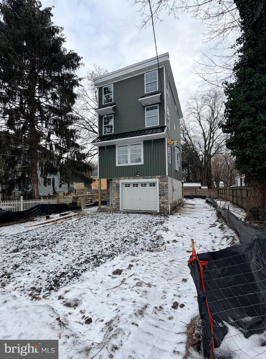 New Construction in Yardley Borough! Quality built F&J Home located in a prime location and within the desirable Pennsbury School District. Find everything on your must have list right here with this 3 bed, 2.5 bath custom built beauty. The craftsmanship throughout this house will leave you the envy of all your friends and family with wainscoting, chair rails, crown molding, recessed lighting & elegant lighting fixtures throughout, beautiful laminate wood floors, and tasteful tilework. No expenses spared!
The entry level at grade conveniently provides a 1-car garage with additional storage area located behind (or perfect area to include as additional living space with sliding glass doors leading to the backyard).
 As you head up to the main level,  the open floor plan sets the perfect setting for your large family gatherings. The layout of this home provides a seamless flow between the living room, dining area & kitchen in the rear. The kitchen is truly amazing! Large white shaker cabinets, exhaust hood, an oversized island with room for the entire family, granite/quartz countertops, subway tile backsplash, stainless steel appliances and plenty of counterspace. Also on the main level you will find a convenient powder room and large deck off the kitchen with steps going down to the backyard. As you continue upstairs to the 2nd finished level, you will be impressed with the size of the bedrooms. There is plenty of storage space including a walk-in closet as well as a dedicated laundry area. The 3rd finished level consists entirely of the primary suite boasting a walk-in closet and ensuite bathroom. The master bath is breathtaking with a freestanding soaking tub, large shower,  double sink vanity, and linen closet. Have peace of mind knowing that everything in this house is brand spanking new from the ground up including the roof, siding, windows, electrical wiring w/ 200 amp electric panel, plumbing, 2 separate HVAC systems- electric heat pumps and central air, interior/exterior doors, floors, lights, kitchen & bath fixtures, even a newly constructed driveway.  Make an offer today and you can customize the home by selecting your own finishes.  Quality built F&J homes are well sought out and the opportunity to customize a brand new home in Yardley Borough is practically unheard of! Enjoy small town living in the heart of Yardley Borough within walking distance to the scenic Delaware Canal trail, shops, & restaurants.  Home is currently under construction with an estimated completion by the end of February 2026. Taxes listed are for the Land only and will be assessed when the construction is complete