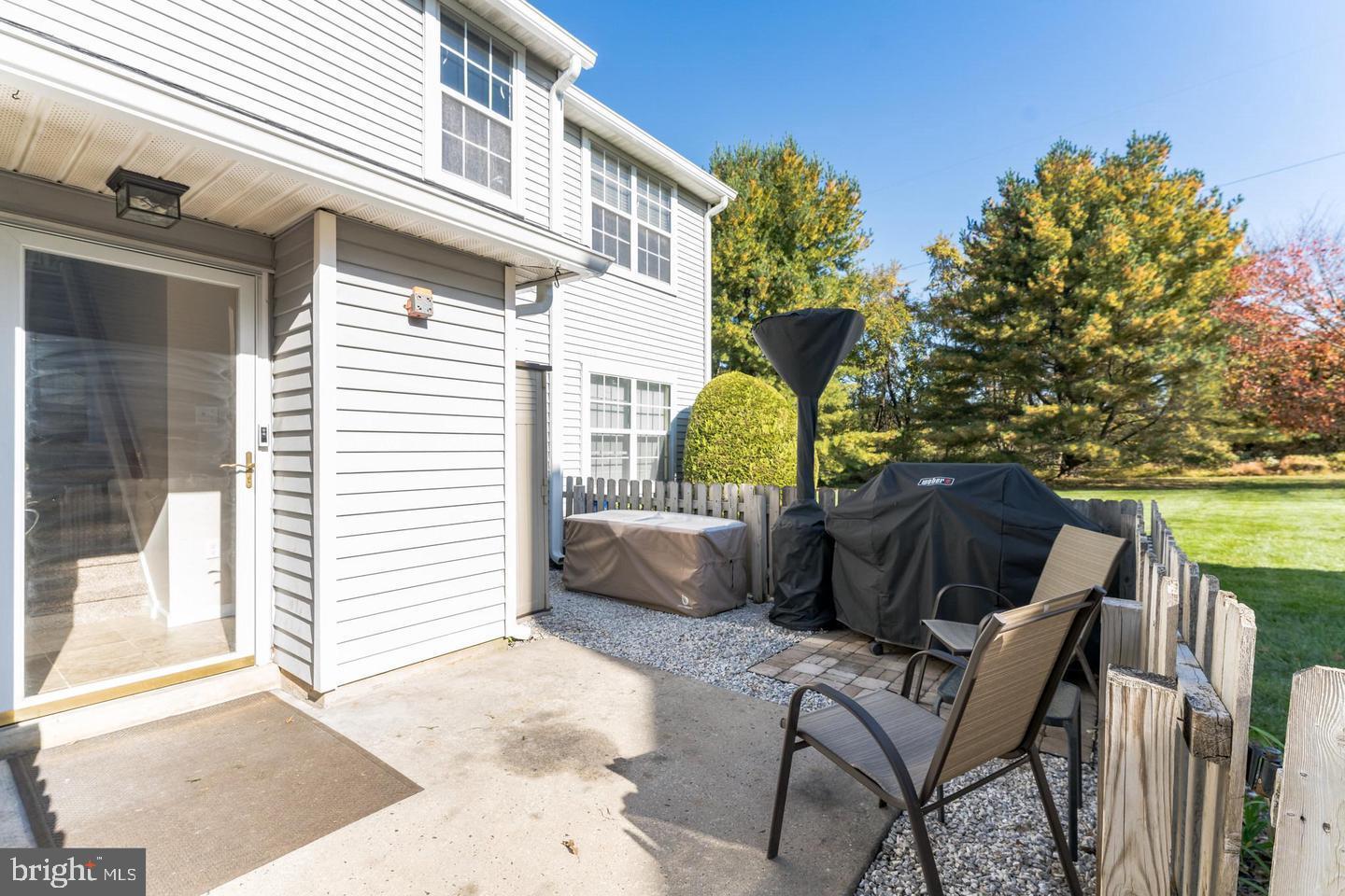 Beautifully renovated second floor condo in Newtown's Country Bend community, in a prime location that backs to open green space. The great room has been opened up, creating an open floor plan, highlighted by newer laminate floors, recessed lighting and will be painted in neutral tones prior to occupancy. The renovated kitchen has Cherry Wood cabinetry, matching stainless appliances and a large island adorned with Granite countertops offering plenty of seating. The main bedroom comes equipped with its own private en suite bath and walk-in closet. An additional well-sized bedroom is serviced by an updated full hall bath. This condo features in-unit laundry, with a full-sized stackable washer and dryer. Simply unpack and start enjoying all the community and Newtown have to offer!