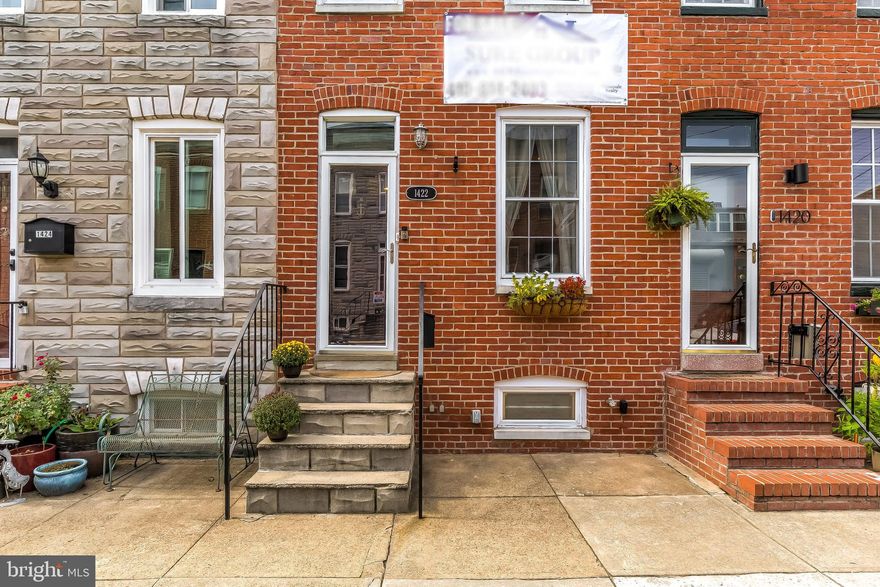 Well maintained all brick row home on a quiet block in Locust Point!  2 bedrooms 1.5 bathrooms with finished basement, huge courtyard, and high end finishes throughout.   The first floor features gleaming hardwood floors, recessed lights, painted exposed brick, a half bath, large dining room, and an upgraded kitchen with 2 tone cabinetry, stainless steel appliances, granite countertops, & tons of natural light.  Upstairs features 2 large bedrooms with a full bathroom and laundry area. The rear bedroom has a private balcony overlooking the courtyard space.  The lower level is half finished, perfect for a 3rd bedroom, office, or additional family room.   This home includes a whole house generator ($10k+ value) that will convey to the next owners.