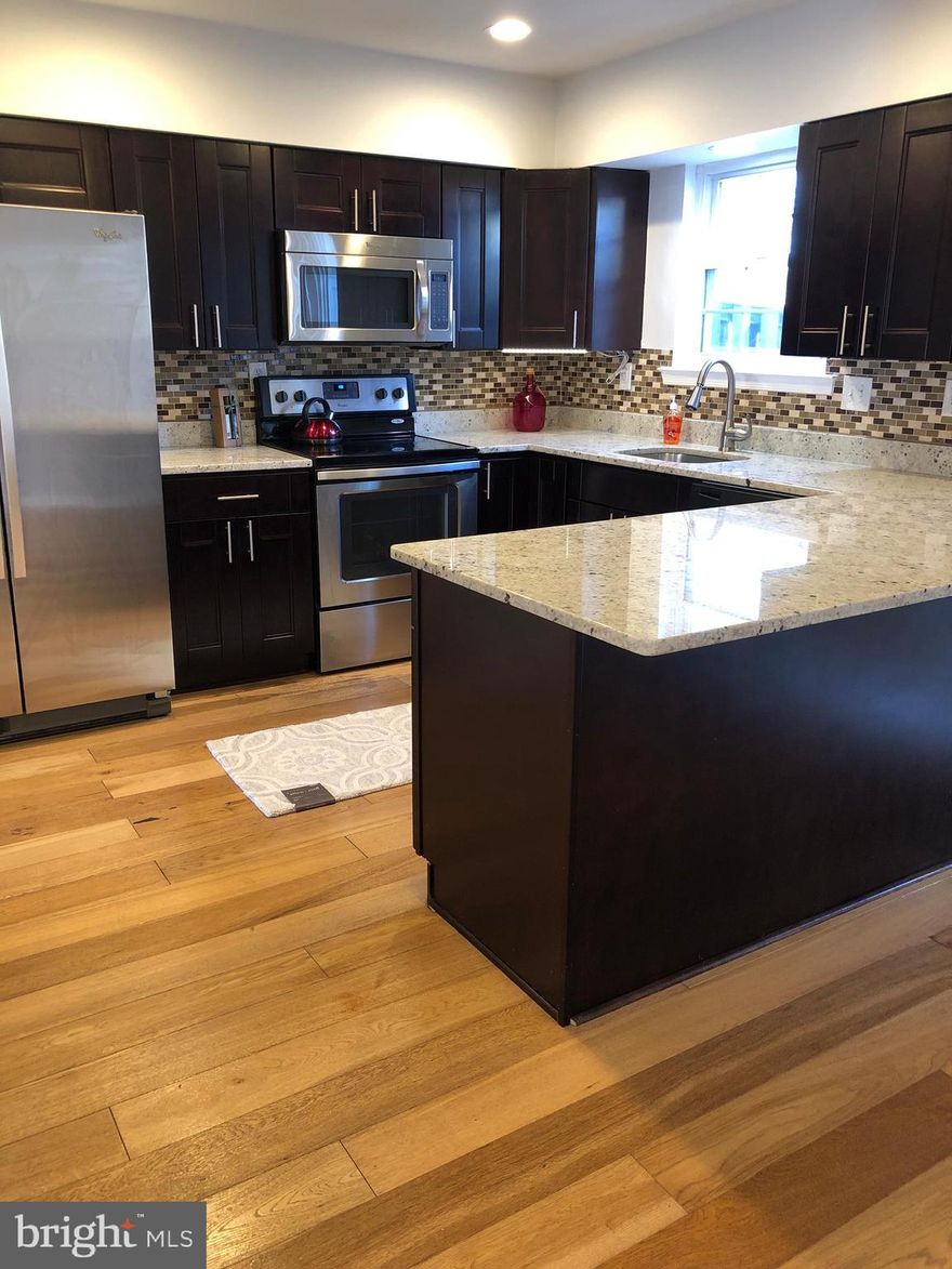 Renovated townhouse in Landover with 3 bedrooms and 21/2 baths.  Fenced backyard, granite countertops, backsplash, stainless appliances.  Open kitchen with large island, and lots of cabinets.