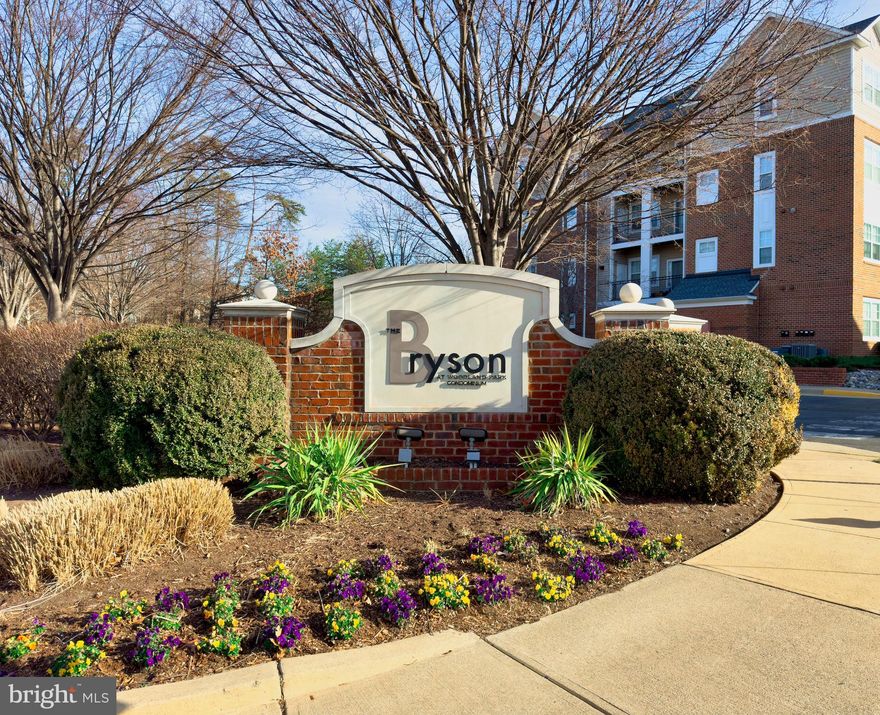 Stunning move in ready ground floor (no stairs or elevator) 2 bedroom/ 2 bathroom gated condo in Bryson at Woodland Park in Herndon. This condo comes assigned with covered parking, freshly painted walls, and brand new carpet throughout. Granite countertops, stainless appliances and in unit washer/dryer included. Large windows with plenty of natural lighting and a covered patio that leads to the pool.  This unit features an abundance of walk in closet space in both bedroom suites, while the main bedroom suite boasts a large bathing tub. Steps to the pools, heated spa, clubhouse, business center, fresh air gazebos, barbecue grills, fireplaces and fully equipped athletic center and billiards room. Easily walk to Woodland Park Crossing to shop at Harris Teeter or grab a bite of food from over a half dozen eateries. Conveniently located to the Silver Line Metro and Dulles Airport.