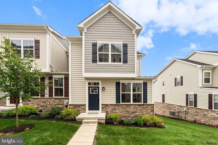Welcome to this thoughtfully upgraded, 3-year-young townhome in the highly sought-after Ponds Edge community in Media. This 3-bedroom, 2.5-bath Serenade model End-Unit combines modern design, luxury finishes, flexible living space, and low-maintenance convenience—all in an unbeatable location.
The bright, open-concept main level features stunning 6.5” Timbre Brushed Silver engineered hardwood flooring and an ideal layout for both everyday living and entertaining. Enter through the spacious Great Room, filled with abundant natural light from its many windows. The gourmet kitchen serves as the heart of the home, complete with a large center island with seating for four, Silestone quartz countertops, an upgraded appliance package, soft-close cabinetry, and a convenient pantry.
The adjoining dining area flows seamlessly to the expanded covered porch featuring a cozy gas fireplace—perfect for year-round enjoyment. A convenient powder room completes the main level.
Upstairs, the spacious primary suite offers a true retreat with a tray ceiling, walk-in closet, and luxurious en-suite bath featuring dual vanities and an upgraded Roman shower with dual shower heads and bench seating. Two additional bedrooms, a full hall bath, linen closet, and  upper-level laundry complete the second floor.
The finished lower level offers exceptional flexibility, making it ideal for a media room, office, playroom, gym, or additional living space. This level also includes an arrival center off the attached two-car garage, coat closet, and two storage rooms.
Additional upgrades include custom blinds throughout (with motorized blinds in the Great Room), dining room wiring for chandelier installation, a gas line hookup in the garage for grilling convenience, black hardware & finishes throughout, and ceiling fans installed in all three bedrooms, the Great Room, and porch for added comfort.
Residents of Ponds Edge enjoy exceptional community amenities, including a clubhouse with a fitness center, playground, walking paths, lawn maintenance, and snow removal. Ideally located just minutes from downtown Media, the Promenade at Granite Run, and SEPTA’s Wawa Station for easy access to Center City Philadelphia.
This move-in-ready home offers the perfect blend of luxury, comfort, and convenience in one of Delaware County’s most desirable communities.
**Special Financing Incentives available on this property from SIRVA Mortgage**