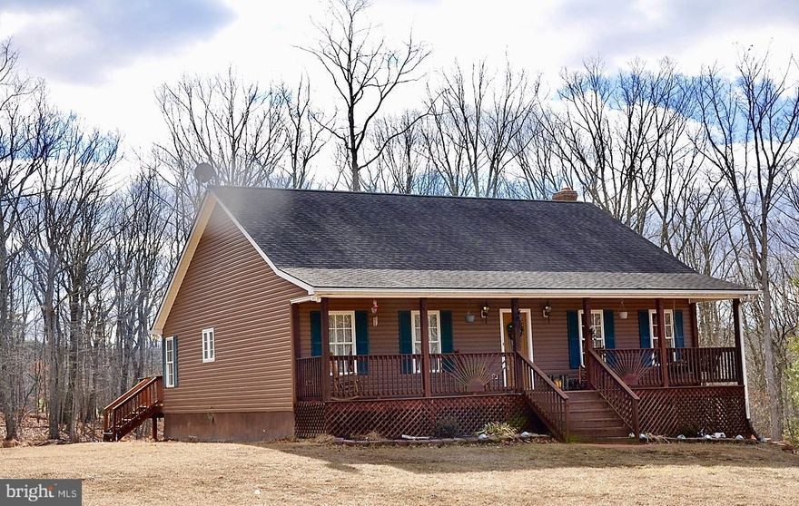 Beautiful Ranch style home nicely tucked away on 6.32 acres, zoned agricultural. This home offers almost 3,000 square feet of finished space, gleaming Red Oak floors, stone gas fireplace, exterior wood stove, large master suite w/ newly renovated master bath & custom shower. This home offers a detached two car garage or storage barn, lower level family room, rec room with bar area for entertaining