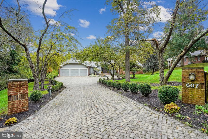 **Charming Home in Great Falls: A Perfect Blend of Luxury and Functionality**

Nestled on a beautifully landscaped 1.75-acre lot in a tranquil cul-de-sac near the heart of Great Falls, this stunning residence offers a peaceful retreat with non-through streets. Designed for single-level living, it features a walk-out basement that provides additional flexibility with 3 bedrooms and 2 baths.

**Primary Suite Sanctuary**  
The primary suite serves as a true sanctuary, boasting multiple walk-in closets and generous built-in storage. The newly renovated curbless, oversized shower includes a bench, two vanities, a private water closet, and large windows that flood the space with natural light. An additional main-level bedroom with an en suite bath offers versatile options for a library, nursery, or office.

**Inviting Living Spaces**  
The main level showcases modern, multi-level shiplap wood ceilings accented with recessed lighting, creating a warm and inviting ambiance. The spacious kitchen and family room are ideal for gatherings, complemented by two office areas and a large laundry room with an attached workroom, darkroom, or craft space. A second versatile room off the kitchen, accessible from the garage, can function as a workout room, mudroom, craft area, or walk-in pantry—limitless possibilities await.

**Multi-Generational Living**  
The expansive walk-out basement is thoughtfully designed for multi-generational living, featuring 2 to 3 bedrooms, a vast recreational room, and additional finished spaces adaptable for various uses. With a kitchenette, pantry, ample storage, and a large entertaining bar, it’s perfect for hosting guests while ensuring privacy.

**Modern Amenities**  
Recent upgrades include new major systems, an elevator, and a full-house generator, enhancing both convenience and peace of mind. The floor plan uniquely combines original design features with contemporary flair,