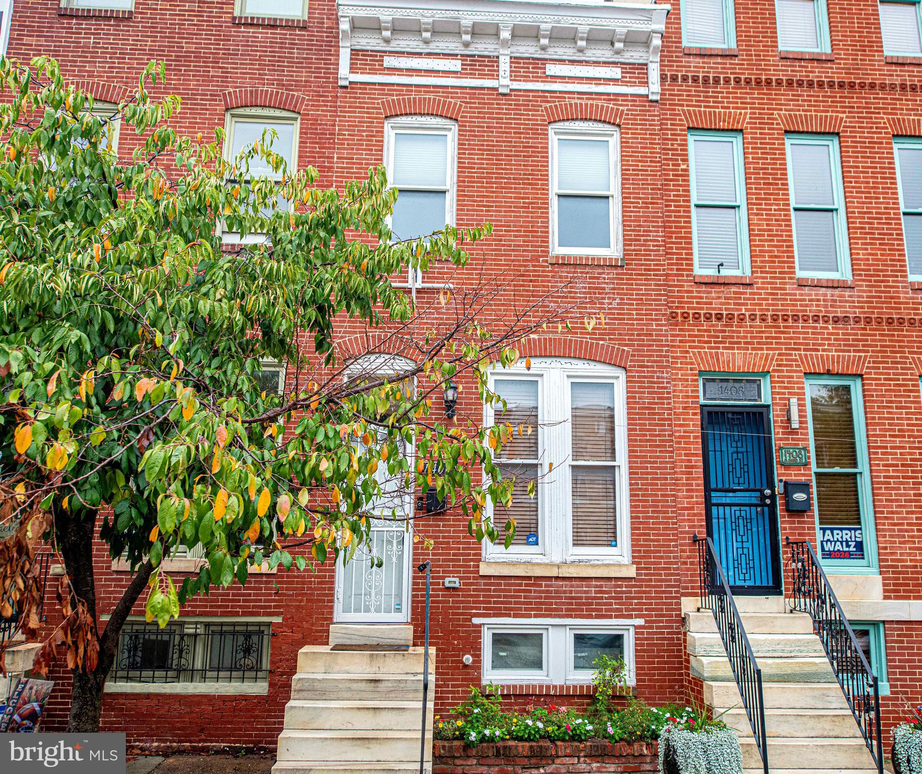 Welcome to this charming Baltimore interior rowhome, where classic elegance meets modern comfort! As you approach, you'll be greeted by beautiful marble steps leading to the front door. Step inside to discover a spacious living room featuring a natural brick wall and a cozy fireplace that sets the perfect ambiance for relaxation. This beautifully appointed home boasts 3 bedrooms and 3 full baths, plus an additional half bath—ideal for families or guests. The kitchen showcases sleek stainless steel appliances, granite countertops, and a convenient breakfast bar, perfect for casual dining. Enjoy the luxury of hardwood floors throughout, complemented by recessed lighting and tall ceilings that enhance the airy feel. Retreat to the primary bedroom, which offers direct access to a private deck—a serene spot for morning coffee or evening unwinding. The primary bathroom is a true sanctuary, featuring a walk-in shower and a separate jetted tub for ultimate relaxation. Freshly painted and move-in ready, this home blends timeless charm with contemporary features. Don’t miss your chance to make this stunning rowhome your own! Schedule a showing today! VA Buyers can assume the balance of this mortgage at 4.5%!!