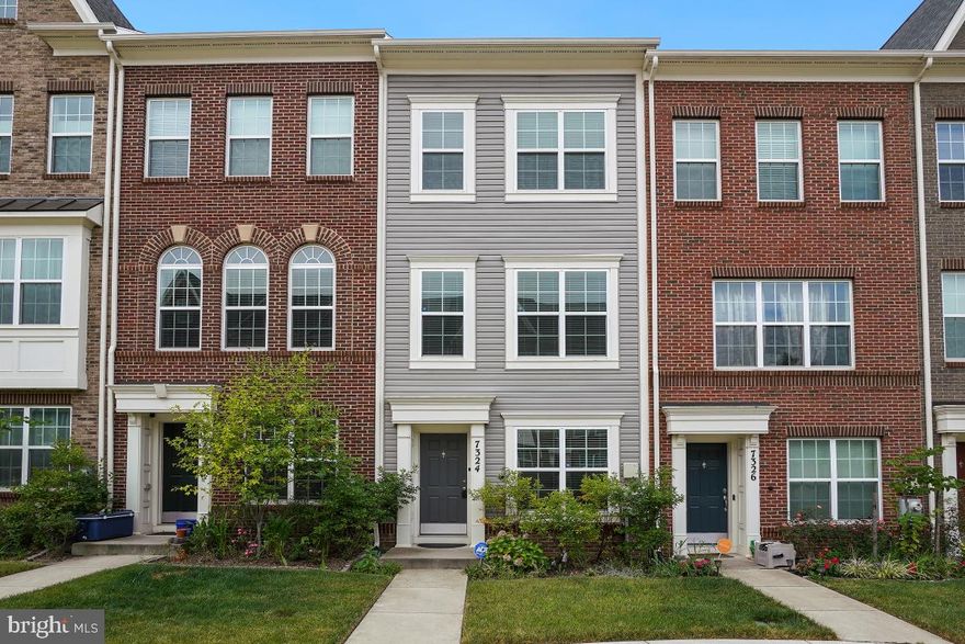 Gorgeous 3 level townhouse located in the new Brickyard development. The entry level foyer opens to an bedroom with a full bath and down the hallway is the garage access. The main level is open concept as its best with hardwood floors throughout, a living area that is flooded with natural light, dining area with access to the rear deck, powder room and a gorgeous kitchen with stainless steel appliances, upgraded counters and a 12 ft. island that is perfect for entertaining. On the upper level are 2 bedrooms each with an ensuite bath and walk in closet and the laundry is also on this level. There is a rear entry garage that houses the utilities and is also large enough for a car and additional storage. This home has a common area front courtyard and is also located in close proximity to the gym and outdoor pool. Minutes ICC and MARC train.