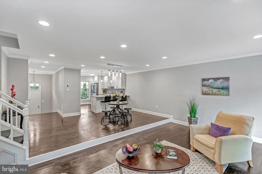 Complete Custom designer renovation from top to bottom done recently. Walk in to an open floor plan with artfully thought of kitchen with huge island, high end stainless steel appliances, Samsung Smart Hub Refrigerator, quartz counter tops & hardwood floors thru out main level and upper level. Spacious master suite and gorgeous bathroom with freestanding tub and marble flooring. Finished basement perfect for entertainment and living. Main level Patio with enclosed backyard and New Trex Deck to enjoy morning cup of coffee. UNBEATABLE LOCATION close to 395, 495, DC, MD. Call to schedule your showing today!! Agent Owner