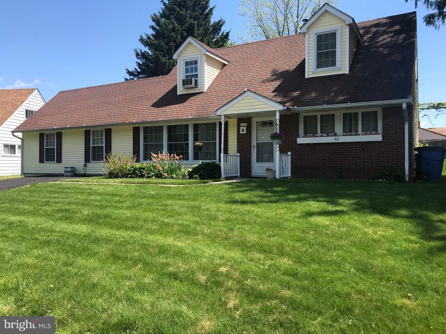 Expanded Neshaminy School District home with hardwood floors ready for the next new owners!  A large wide driveway for plenty of parking and a beautiful flower garden adds to curb appeal as you pull up to the home.  Walk in and the floor plan is spacious as you notice the hardwood flooring throughout the main level.  A large living room with newer large windows that allow plenty of natural light.  Also on this level is an additional extra large over 24 Ft  family room and an 18 ft dining room, great for your entertaining!   The kitchen is bright and sunny with a sliding glass door that leads to the outdoor patio space and an above ground swimming pool with deck! This sparkling pool is ready for you and your guests to enjoy the day you move in! There is also a large storage area in the back yard for tools and yard equipment. Back into the home there are 2 bedrooms on this level also and a newer full bath.  Stack washer and dryer along with a large linen closet is also on this level. Hardwood stairs take you to the upper level with 2 more bedrooms and a beautiful full bath.  The master bedroom has a large lighted walk-in custom closer that has space for plenty of shoes, clothing and shelving all the way around along with mirrors for your private dressing area.   Dormers on both bedrooms upstairs allow more natural light into these two bedrooms.  All bedrooms have been newly carpeted and painted!  Cone see this beautiful spacious home  with large yard and addition today!