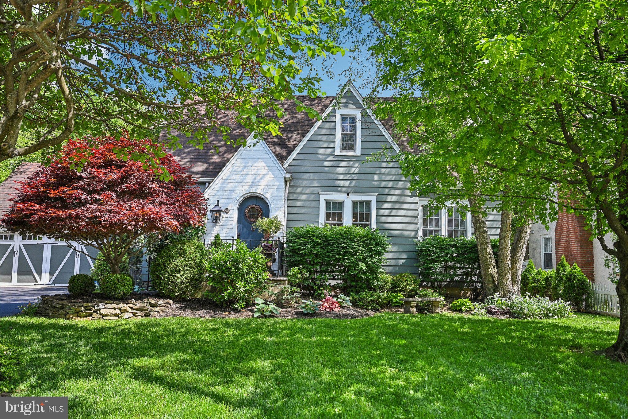Welcome to this stunning, completely updated home, nestled on a spacious quarter-acre lot in the highly-desirable Beechwood neighborhood of Havertown. From 2019 to 2020 no detail was overlooked as the entire property underwent a thoughtful renovation, blending classic charm with modern convenience. The delightful exterior invites you in with mature well-tended plantings and lovely flower gardens. As you approach the arched front door by the newly redone landing and steps, come inside to discover a warm and inviting home with refinished hardwood floors and new Anderson wood windows throughout. The beautiful living room features a newly renovated gas fireplace with custom built mantel and new stone, creating a charming focal point. Across the center hall find a bright full dining room which flows into an absolute dream of a kitchen where you’ll find soapstone countertops, a spacious island with beautifully designed storage, Wolf induction cooktop, built-in Bosch refrigerator and Miele convection and steam ovens. The kitchen, which also offers a convenient nook for coffee making and more, opens to the spacious family room, perfect for relaxing and entertaining. From here, you are beckoned outside through a slate-tiled alcove and French doors leading to a cozy covered deck, where you can walk out to the patio and back yard if desired. The first floor includes a sunny bedroom with ample well-designed closet space, offering flexibility for those looking for a first floor bedroom or home office. On this floor also find a completely renovated gorgeous tile hall bathroom with walk-in shower. Upstairs are redone hardwood floors, a second renovated tile bathroom, and 3 bedrooms. The main bedroom includes a new walk-in closet addition with a window. On the lower level, the finished basement has been completely redone including the staircase, providing additional living space and a nicely-sized half bath. On this level you’ll also find the laundry room and easy access to the back yard through redone steps and a gate leading out. Once outside, you’ll fall in love with the new flagstone patio, surrounded by garden beds, ample flat lawn space, and a skip laurel hedge and smart-looking newer fence providing privacy. The wooden shed offers convenient storage tucked away in a corner of the yard. Parking is no problem with the separate double garage which includes a second-story loft, offering additional storage and the potential for a creative space. The garage can be accessed through a side door from a landscaped breezeway with a splendid custom arched gate leading to the back yard. Additional upgrades include a new roof, new driveway and curb apron, completely redone HVAC and electric with a new electric panel, and new Smith and Noble custom window shades. This turn-key home, lovingly transformed by owners who planned to stay but are now moving to be closer to family, offers a comfortable, convenient, and stylish living experience in a vibrant neighborhood close to Linwood Park, Karakung Swim Club, schools, transit, restaurants and shopping. Don’t miss this opportunity to see this beautiful home and call it your own!
