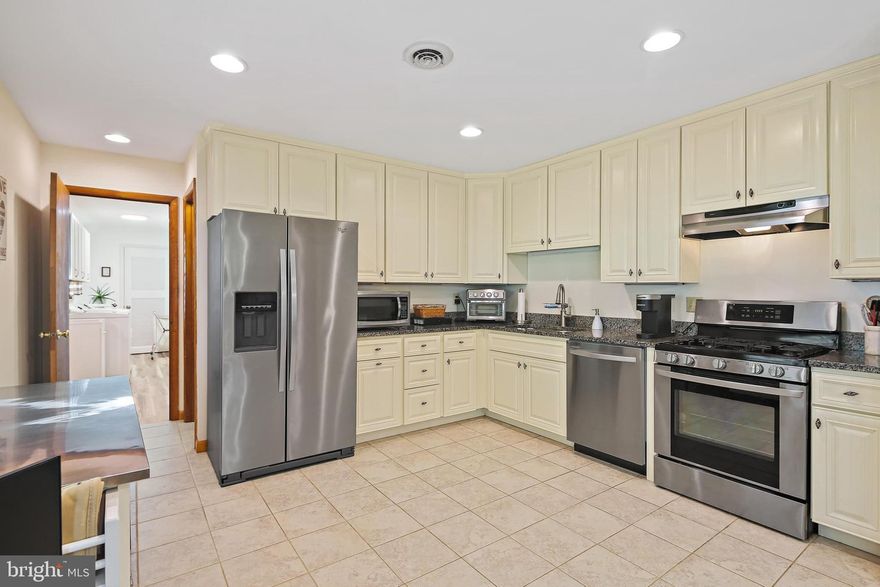 Price Adjustment!! Stunning 3-bedroom, 2-full-bath brick rancher that truly stands out. You'll immediately notice the abundance of natural light throughout the home, highlighting the beautiful hardwood floors. It's clear that the current owner has taken great care of this property, which seamlessly blends traditional charm with modern updates. The bright and airy kitchen features white cabinets, stainless steel appliances, and granite countertops, and it opens nicely to the dining and living rooms, creating a wonderful flow for entertaining. Just off the dining area, you'll find sliders that lead to a lovely, light-filled sunroom and a large, flat, fenced backyard with a storage shed – perfect for outdoor enjoyment. The large first floor laundry room is a plus and makes life easier. The basement offers a cozy and spacious area for entertainment and additional rooms for storage or potential upgrades to office, workshop, home gym or bedrooms. The two-car garage and extended driveway with tons of parking are a nice added bonus.  Also, adding to the appeal, the current owner has recently made significant improvements, including a new oil furnace, A/C unit, well pump, septic line, a beautifully renovated hall bath, a bright new sunroom and so much more! Owner has taken great care of maintaining and updating the home!!