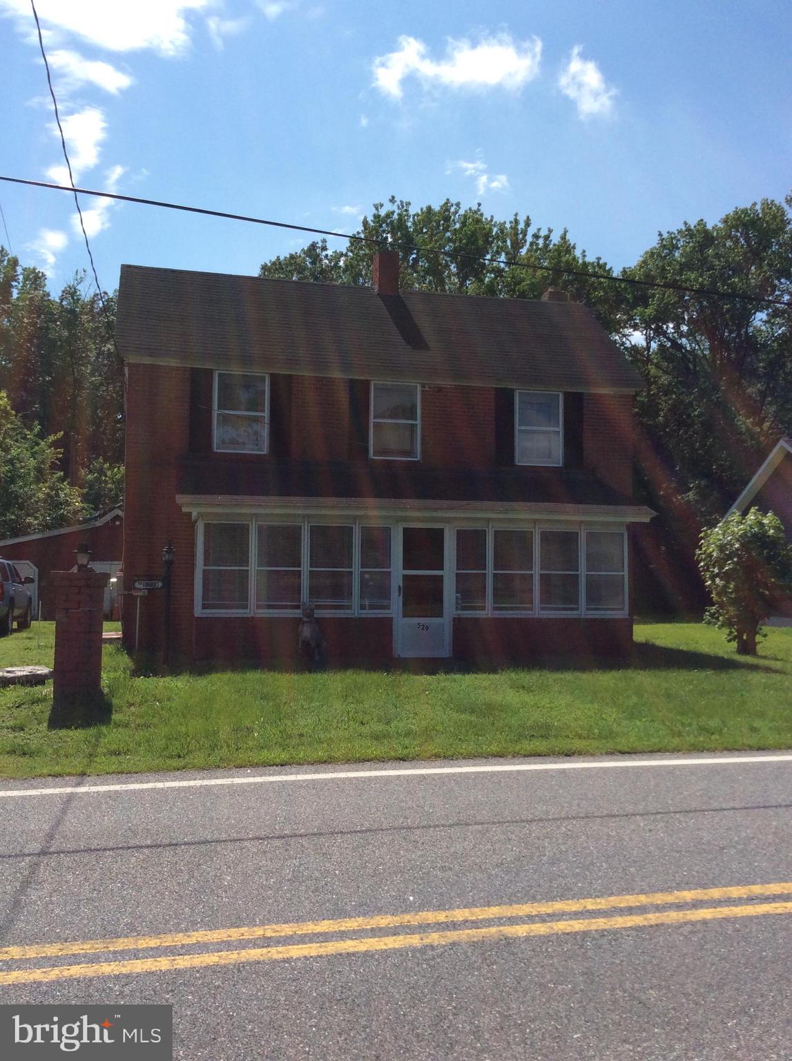 1900 Brick home that is solid but needs rehab done inside. Nice hardwood floors. Owner had started renovation. For the price could be a great home for your family. Large in town lot with several outbuildings for storage, hobbies or garage. Wooded behind home for privacy in town. Convenient to Delaware, Denton, Centreville and all in between.