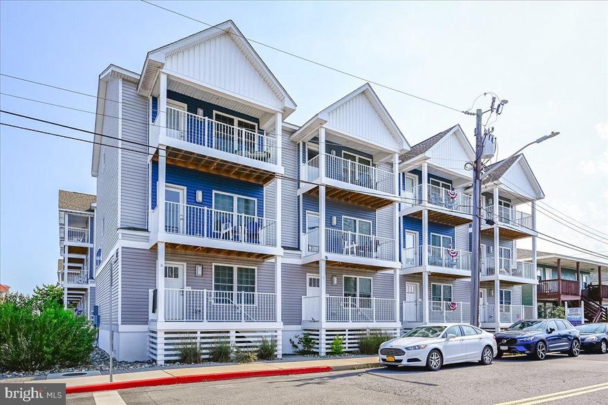 Spectacular three level townhome located in the heart of downtown Ocean City! Situated a few short blocks from the beach, and similar distance to  enjoy the Bay and local fishing pier. This 3BR 3.5BA unit was built new in 2020 with many upgrades and has a wonderful floor plan for entertaining.  Upon entry you  will notice the luxury vinyl plank flooring, beautiful coastal decor, convenient entry level bedroom with full bath, and access to the attached garage. The two car garage and community pool are rare finds! The garage offers plenty of room to park and still has additional space to store all those beach items.  Head upstairs to the main level where there is  a spacious kitchen overlooking the family room with upgraded cabinetry, quartz counters, tile backsplash and huge breakfast bar.  This sun filled beach home features numerous windows and balconies on every floor. The primary bedroom is located on the upper level and includes a private balcony, cathedral ceiling, his and her closets, and a luxurious en suite bath. There is an additional bedroom on this floor with an attached full bath, two closets, and balcony access. The laundry is also conveniently located upstairs and features a full size washer and dryer.  This property shows true pride of ownership and has never been rented. Beautiful custom paint, designer furnishings and Hunter Douglas window treatments throughout. No rentals to honor and being sold fully furnished, so enjoy this  turn-key townhome immediately. Should you to decide to rent there are comps in the condominium grossing over 47k per season. Don't wait to schedule your private tour of this better than NEW unit. Truly a must see!