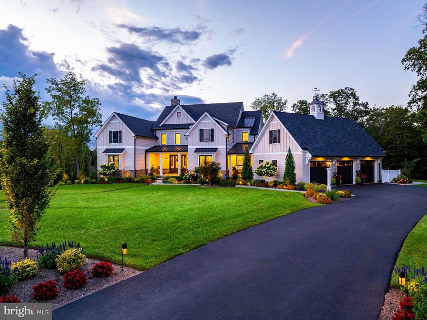 Why travel when home feels like a five-star resort? Welcome to this nearly new 7,000 sq ft custom residence tucked at the end of a quiet Gwynedd Valley cul-de-sac of just seven homes—where everyday living feels like a year-round getaway.
This elegant home has been designed for comfort, convenience and entertaining. The main level offers : a first-floor owner’s suite with vaulted ceilings and sitting area, a spa-worthy bath with heated tile floors, soaking tub, dual vanities, make-up station, and a custom walk-in closet..
Entertaining is effortless with four kitchen areas and three fireplaces. The main kitchen features Wolf, SubZero, and Bosch appliances, quartzite countertops, banquette seating, a coffee bar, and adjoining back kitchen with farmhouse sink, refrigerator, additional dishwasher and pantry for seamless prep. A chic mini-bar with SubZero wine fridge completes the space. Step outside through twin 12’ glass sliders to a covered terrace with skylights, outdoor fireplace and TV, Lynx-equipped kitchen, and expansive dining and seating areas. The heated saltwater pool and spa, expansive decking and with a grotto fire pit—it’s an entertainer’s dream. The fully finished walk-out lower level adds an additional full kitchen, SubZero-equipped bar, gym, full bath, dual-sided fireplace, and recreation areas, in addition to a 12’ slider that leads to a covered patio and the pool area.
Upstairs, a retreat-style loft lounge with bar, three bedrooms (all with custom closets and ensuite or Jack-and-Jill baths), plus a third-floor bonus room, creates flexible living for guests, family, or work-from-home needs.
A 3-stop elevator ensures easy access to all levels, making this a forever home. Every detail has been fortified for peace of mind: whole-house generator, Lutron lighting system, Honeywell security, Luma cameras, Sonos sound inside and out, central vacuum (including garage), three HVAC systems across five zones, two Navien tankless water heaters, a water softener and integrated cabling/Wi-Fi throughout. Car enthusiasts will love the three-car garage with epoxy floors, slat walls, custom cabinetry, and a 240-volt line for an EV charger.
Set on 1.68 private acres that back up to wooded lands, the property offers lush landscaping with irrigation and lighting, and expansive outdoor living spaces. Proximity to the Gwynedd Valley train station, Wissahickon Trails, and Lower Gwynedd’s scenic walking paths complete the picture.
This is not just a home—it can also be your luxury staycation home.  Call for your showing TODAY!