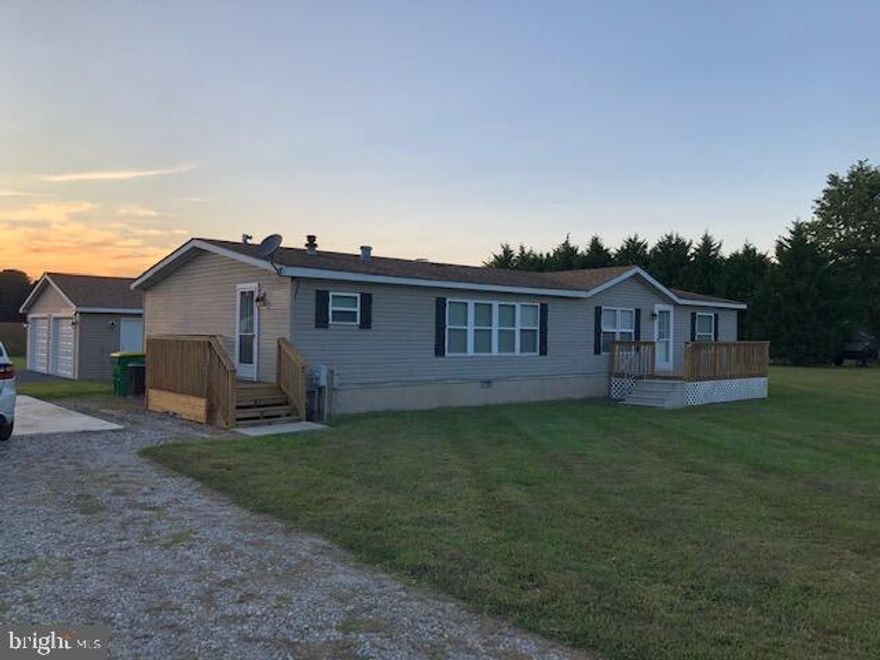 This property is being sold as a small subdivision.  ONLY interested parties in the whole property should inquire about this property.  Mobile home is not being sold separately.  There are 3 parcels involved for a total of 5.06 acres.  There is also a shared driveway to access the parcels.  The first parcel features a 3 bedroom 2 bathroom double wide mobile home with a gas fireplace and beautiful upgraded kitchen featuring granite countertops and SS appliances. that has been fully upgraded. The other 2 parcels are empty lots each at 1.86 acres. These additional lots are listed as 230-21.00-4.16 and 4.17.  Permits are available for serious buyers.  The road will be required to start or complete before the lots can be sold.  This is a great opportunity for a contractor to develop this subdivision.