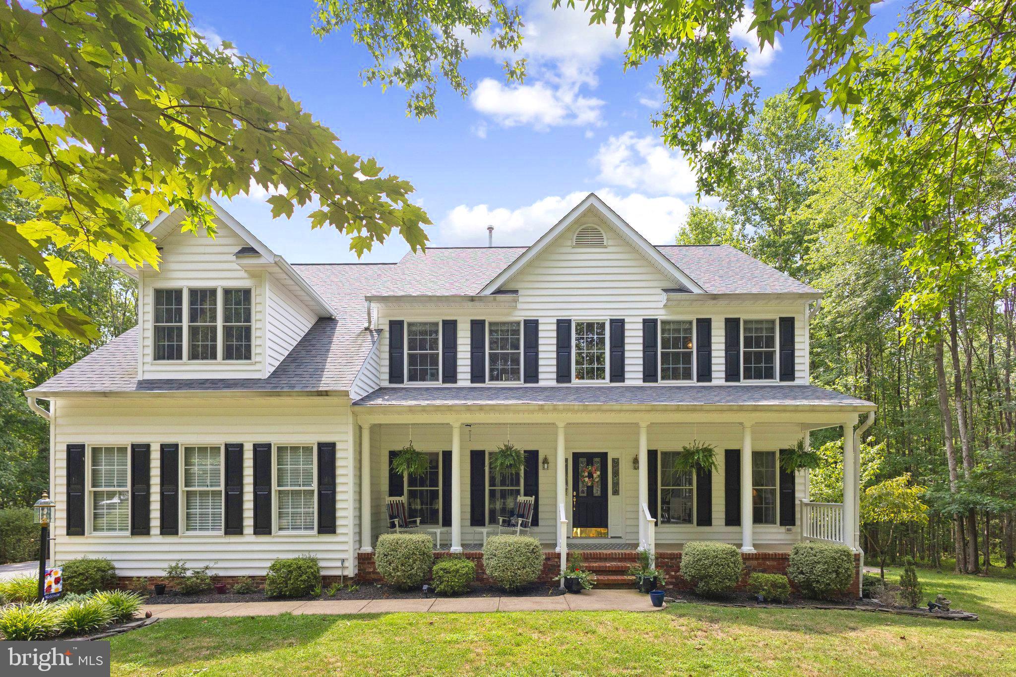 4.125% VA ASSUMABLE LOAN!Contact your agent or listing agent for details.
No HOA! Public water and sewer! Step into what may be the cleanest home on the market in North Stafford—short of new construction! Pride of ownership definitely shows in this meticulously maintained home with endless tasteful updates throughout. The long, winding driveway creates a sense of anticipation as you pull up to this classic colonial-style home with a full country front porch that delivers incredible curb appeal from the moment you arrive. This impeccable 4-bedroom, 2.5-bathroom home on a full unfinished walk-up basement sits gracefully on just shy of 4 acres in the highly sought-after community of Magnolia Woods. A sea of gorgeous hardwood flooring that sprawls through the entire main main level awaits you as you enter into the dramatic, open & airy 2-story foyer. Glance to the left to capture the main level study/office with crown molding. To the right you will find the formal living & dining rooms featuring detailed chair railing, crown & shadow box molding. From the foyer continue on into the recently updated amazing gourmet kitchen boasting gorgeous granite countertops, tile backsplash, a chef-grade Kenmore Elite gas cooktop stove w/ range hood, sleek stainless steel appliances, under-mounted stainless steel sink, recessed lighting, built-in desk area, & the super convenient center island with ample storage & breakfast bar w/ seating available. Just off of the kitchen you will find the eat-in area & the spacious family room highlighted by the cozy full stone fireplace with gas log insert!Off of the eat-in area is the light-filled sunroom with picturesque views out to the spectacular backyard featuring a small composite deck off of the sunroom, the incredible outdoor kitchen slate patio area w/ built-in grill & mini fridge, & another 2nd composite deck just off of the slate patio that leads to the amazing screened gazebo! The impressive paver stone walkway makes it a breeze to cruise from the driveway to the backyard or all the way around to the walk-up basement entrance, the shed offers generous amount of storage for extra tools & equipment & the firepit just adds yet another area that makes this backyard an absolute perfect place to entertain! Back inside & on the upper level of this gem enjoy a grand owner's suite w/ a small sitting area, massive walk-in closet, soaring cathedral ceiling & the luxurious en-suite bathroom showcasing the breathtaking claw foot tub, an outstanding tiled walk-in shower, & features newer quartz countertops & Kohler faucets on the dual vanities. Completing the upper level you will find 3 additional spacious bedrooms all outfitted with detailed crown molding & ceiling fans, the 2nd full bathroom, & an oversized upper level laundry room with built in cabinetry, folding table & utility sink. Finally, down on the lower level the full unfinished walk-out basement features impressive 9-foot ceilings & offers incredible potential for future expansion or simply additional storage. Already plumbed & improved with a new egress window that was installed in 2021, the basement is ready for someone's vision and is positioned for a 5th legal bedroom & a 3rd full bathroom. A few additional notable highlights of this beauty include a new architectural roof in 2017, brand new hot water heater July 2025, new KitchenAid dishwasher in 2022, & new fencing in 2024. From repainting of gazebo & shed to new toilets & fixtures throughout there are far too many improvements the sellers have continually made the past few years to list! For nature/wildlife lovers, I wanted to add that I have yet to drop by the home & not seen deer or wildlife out back! As you can see, there are endless features offered up in this exceptional turn-key property that clearly shows pride of ownership & is planted on a fantastic private lot in a well established & desirable community, making it easy to see that this home is your perfect choice!!