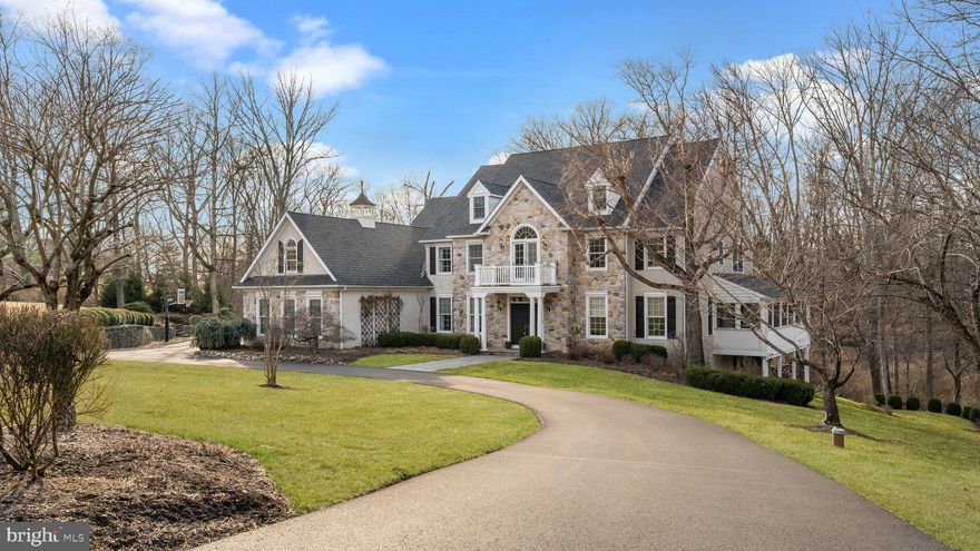 Discover the perfect blend of timeless craftsmanship and modern luxury in this stunning Richard Zaveta-built residence, located in the highly sought-after Weatherfield community of Upper Makefield. Set on two beautifully landscaped acres, this distinguished four-bedroom home seamlessly combines elegance and comfort.  Ideally situated for commuters, this exceptional home offers convenient access to major metropolitan areas. With easy connections to I-95, Route 1, and nearby train stations, reaching New York City, Philadelphia, and Princeton is effortless. Whether commuting for work, enjoying a weekend getaway, or traveling for business, this prime location ensures that world-class dining, cultural attractions, and top-tier business districts are always within reach.  Every detail of this home has been thoughtfully enhanced, including newly refinished hardwood floors throughout, along with refreshed staircases and railings that add to the home’s refined appeal. The heart of the home is the completely renovated gourmet kitchen, boasting custom cabinetry, granite and quartzite countertops, high-end Sub-Zero and Wolf appliances and updated lighting. A spacious walk-in pantry, Butler’s pantry, and elegant wet bars featuring soapstone counters—add both sophistication and functionality. The formal dining room showcases built-in cabinetry, offering both style and practical storage, while the inviting living room features a cozy fireplace. The expansive family room is a perfect gathering space, complete with a striking wood-burning stone fireplace and a custom-built TV cabinet.  For those who work from home or seek a private retreat, the sophisticated office space is a true sanctuary. Thoughtfully designed with custom built-ins, this refined workspace offers both beauty and functionality. Expansive windows frame stunning views of the lush wooded landscape, creating a tranquil and inspiring setting, while direct access to the screened-in porch allows for seamless indoor-outdoor living.
The thoughtfully designed mudroom and custom laundry room feature built-in cabinetry, heated herringbone brick floors, and direct access to both the garage and the backyard—offering the perfect transition space for daily living.  The luxurious primary suite provides a private retreat, featuring a spa-like en suite with a soaking tub, spa shower, and wraparound windows that flood the space with natural light. A custom dressing room and generous walk-in closets offer exceptional storage, including a cedar lined closet.   An adjoining bonus room—accessed through French doors—creates a serene escape.  Three additional bedrooms, each with ample walk-in closets, and beautifully updated bathrooms complete the upper level.
The fully finished lower level is designed for both relaxation and entertaining, with oversized windows filling the space with natural light. A state-of-the-art media room, a sophisticated wet bar with soapstone countertops, bonus room and full bath  make this level an ideal space for guests or extended family.  There is also a workout room and ample storage on this level, as well.  Throughout the home, designer details elevate every space, from the charming window seats and custom cabinetry to the exquisite wet bars and thoughtfully chosen chandeliers and wall coverings.  Step outside to experience the home's breathtaking outdoor spaces. A new composite deck with sleek railings, a screened-in porch, and a beautifully designed patio overlook formal gardens, a sparkling in-ground pool, and private,  lush wooded surroundings. The professionally installed irrigation system ensures the grounds remain pristine year-round. Designed for both comfort and convenience, the home also features a whole-house generator, providing peace of mind in any season.  With every detail carefully curated, this extraordinary estate offers refined living in an idyllic setting in the heart of historic Bucks County.