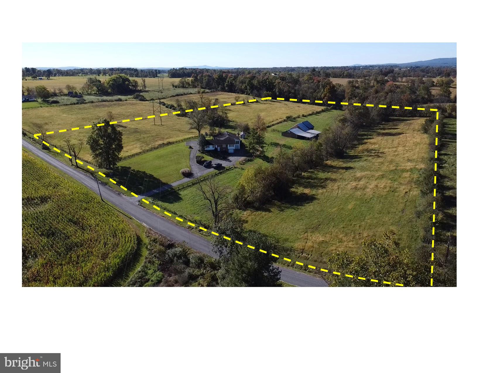 Discover your rural oasis: a spacious 5-bedroom, 3 and 1/2 bath home sited on 11.3 acres with a 12 stall barn. This expansive home is set on a picturesque 6.6 acre lot and INCLUDES an adjacent 4.7 acre lot. This property is Ideal for those seeking a serene rural lifestyle.
The home features large, open-concept rooms that are perfect for family gatherings and entertaining friends The main level includes four bedrooms, 2 full and one half bathroom, 2 fireplaces, and several huge gathering places: a 600 SF family room with stone fireplace, a 300 SF sitting room with stone fireplace, a 450 SF living, a 200 SF kitchen (with table space) which is adjacent to both a 200 SF dining room and a 100 SF breakfast room. Imagine hosting holiday gatherings with enough room to host a small army of relatives and friends. The main level also includes a 14' x 9' sun room with oversized windows and a 10' x 8' laundry room abundant storage. The lower level includes another bedroom, a flex room that could possibly be converted to a 6th bedroom, a full bathroom, a 300 SF recreation room, a workshop and unfinished storage room that's over 1,000 SF.
The property is ready for your animals. The 36' x 80' barn includes 12 large stalls, a 12' center aisle, 2 feed rooms, a full length hay maw with 2 interior hatches allowing bales to be dropped to the aisle (and out of the weather), and is served with water and electric. A 30' x 60' lean-to is attached to the barn. Adjacent to the barn are two pastures totaling almost 2 acres and 7 acres of productive hay fields.
Nestled in a peaceful rural setting, you'll appreciate the privacy and mountain views while still being conveniently close to local amenities, schools, and outdoor activities. Drive to the major retail centers (Wegmans, Lowes, Walmart, Marshalls, Giant Food, Madrones, Black Hog etc.) in 15 minutes. Historic downtown Frederick is a 20 minute drive; Utica Regional Park and the future Richard Kanode equestrian and farm park are both less than 2 miles away.
Schedule your tour today! Don’t miss the chance to make this remarkable property your own.