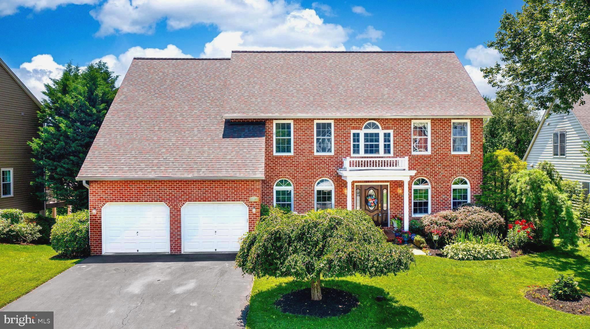 This stately brick-front 4-bedroom, 5-bathroom colonial has more than 3,000 sq ft of finished living space above grade in addition to a fully finished walk-out basement! Featuring a 58-foot-long deck offering serene views of your own Koi pond with waterfall and the expansive green space beyond. Inside, the main level features hardwood flooring throughout, including a grand hardwood staircase. The updated kitchen includes KraftMaid soft-close cherry cabinets, granite countertops and an island with a breakfast bar. Appliances include a GE Profile double wall oven (2025), Samsung refrigerator (2024), a Bosch dishwasher and a JennAir 5-burner gas cooktop. This level also features a living room with fireplace, separate dining room, an office/den, half bath and laundry room including a newer GE Profile washer/dryer, pantry and utility sink. Upstairs, the primary bedroom with newer carpet is generous in size and features a sitting area, two walk-in closets, and ensuite bathroom with jetted soaking tub and separate shower. Each additional bedroom has access to a bathroom—one with a private full bath, and the remaining two bedrooms share a Jack-and-Jill style full bath. The wide open finished basement is nicely detailed with chair rail, shadow box and crown molding. It also offers full size windows, wet bar, full bathroom and the possibility of creating a 5th bedroom. Recent updates include newer Atrium double-pane tilt windows for energy efficiency, a new roof and gutters installed in 2021, newer HVAC and water heater in 2020. Located in the sought after Lake Linganore neighborhood of Westwinds featuring its own outdoor community pool in addition to all the private amenities that the Lake Linganore Community offers overall including lakes, beach areas, pavilions, tennis courts, playgrounds, trails throughout and additional community pools and events...truly an amazing lifestyle! Come see this stunning home in-person!