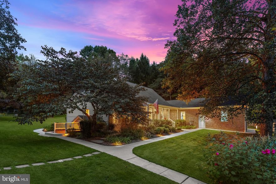 Welcome to 3160 Sandy Hook Road, a sprawling 5,507 SQFT beautifully maintained home tucked away in a private, natural setting just minutes from Bel Air conveniences. This charming property blends comfort and functionality with plenty of space for modern living. Inside, you’ll find an inviting floor plan with abundant natural light, generously sized rooms, and tasteful finishes throughout. The kitchen and dining areas flow seamlessly for everyday living and entertaining, while the family room offers a warm and welcoming place to gather.
 5-bedroom, 3.5-bath. Step through the decorative front door that is adorned with sidelights and a transom, into a sun-filled open floor plan featuring hardwood floors throughout the hallway, dining area, and living room (refinished July 2024). The dining room flows seamlessly into the gourmet kitchen, boasting custom 42” cabinetry, peninsula and center island, Silestone countertops, GE appliances, and a breakfast nook with bay window, perfect for casual dining. Adjacent is a sunroom surrounded by windows and transoms, with a triple center-hinged door opening to the 395 SF rear patio with outdoor lighting. The living room serves as the heart of the home, featuring a wood-burning QuadraFire stove for warmth and ambiance, while ceiling fans in most rooms maintain comfort year-round. The main level primary suite offers two walk-in closets and a luxurious suite bath with a soaking tub, a separate spacious walk-in shower with a bench, and dual sink vanities. The main level also includes another bedroom, a half bath, a spacious laundry/multi-purpose room with storage shelving, a large pantry, and a drop zone with garage access, rounding out this main living level.  On the upper level, you’ll two bedrooms and a dual-entry bath for added convenience, a linen closet, and a walk-in attic space. 
The finished lower level extends the living space with a recreation room, perfect for billiards or family game nights, a family room, a separate bonus room added as a fifth bedroom, and a full bath.  With the double-door walkout access, separate storage/mechanical areas, and a utility room for sump pumps and a dehumidifier, this level balances entertainment and function seamlessly.
Additional features include an attached 2-car garage with interior and exterior access, shelving, and a workbench; Geothermal HVAC system with 3-zone control; radon control system; whole-house water filtration; Anderson windows; and a hot water heater replaced in 2025. The fenced yard (partial) with gated driveway.  included items curtains, garage shelving, washer/dryer, 2nd refrigerator, patio table with 4 chairs, and even a farm pickup truck if desired, enhance the lifestyle this property offers.
With 3,211 SF above grade and 2,296 SF below grade, this home blends country tranquility with thoughtful modern updates, offering ample space for family, entertaining, hobbies, or simply enjoying nature year-round. From the sunlit interiors to the private patio and expansive grounds.