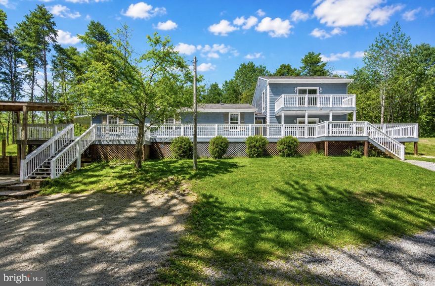 Stunning renovated home on 3 acres with Lake Anna access! This 4-bedroom, 2-bath property offers space, style, and flexibility throughout. The oversized gourmet kitchen boasts granite countertops, a massive island, pantry, and additional storage room—perfect for both everyday living and entertaining.

The large family room with a cozy wood stove creates a warm and inviting atmosphere, while the primary suite impresses with a custom walk-in closet and spa-like bath featuring a jacuzzi tub, separate shower, and double sinks.

Upstairs, a bonus room provides endless possibilities—home office, gym, or playroom. Step outside to multiple spacious decks, including a second-level deck, and enjoy the peaceful surroundings. Plus, a storage shed for added convenience.

Your Lake Anna lifestyle starts here!