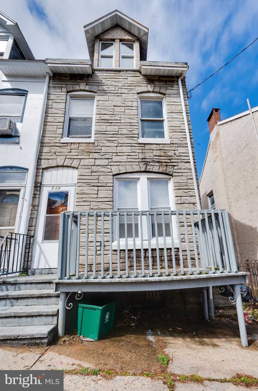 Nice corner row home ready for its new owners. This is a clean four bedroom one bath home that was previously used as a rental. The first floor has laminate flooring in the living room with ceramic tiles throughout the dining room and kitchen. The second floor consists of a full bathroom and three bedrooms with the fourth bedroom being located in the attic. The basement is unfinished and has a dryer and washer connection.  With some TLC this can serve as a great starter home with the potential of off street parking in the back.